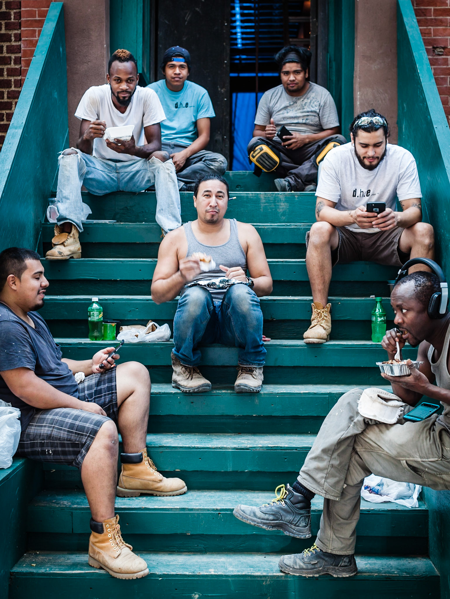 The brownstone rennovation crew gathers on the stoop for lunch every day across from my office. Today they kindly let me document their break.