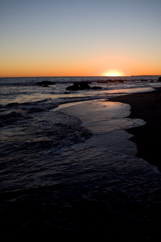 Malibu; California; Sunset; Beach; Sand; Waves; Rocks; Paradise; Vacation; Reflection.
