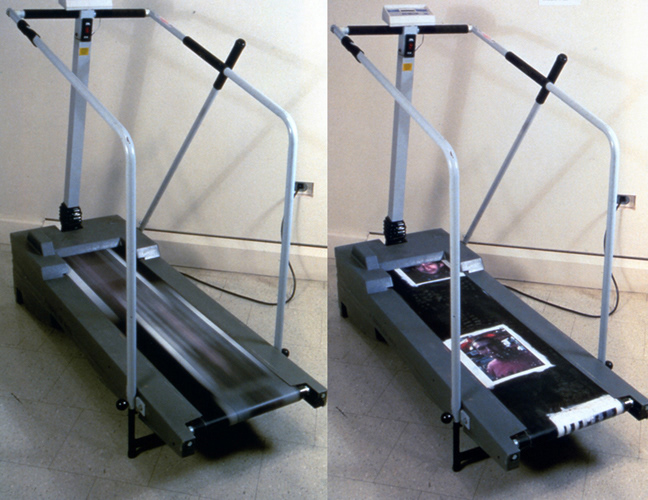 Your Mortification 1998. Treadmill, photographs, primer. 50” x 24” x 56” Faces of men and women are plastered on an exercise treadmill. The viewer gets on it and walks / jogs / runs on it. The harder and faster the participant goes, the more one is hurting people. This piece is about being self-centered and self-absorbed and symbolizes how far are one is willing to go to hurt other people and try to get away with it.
