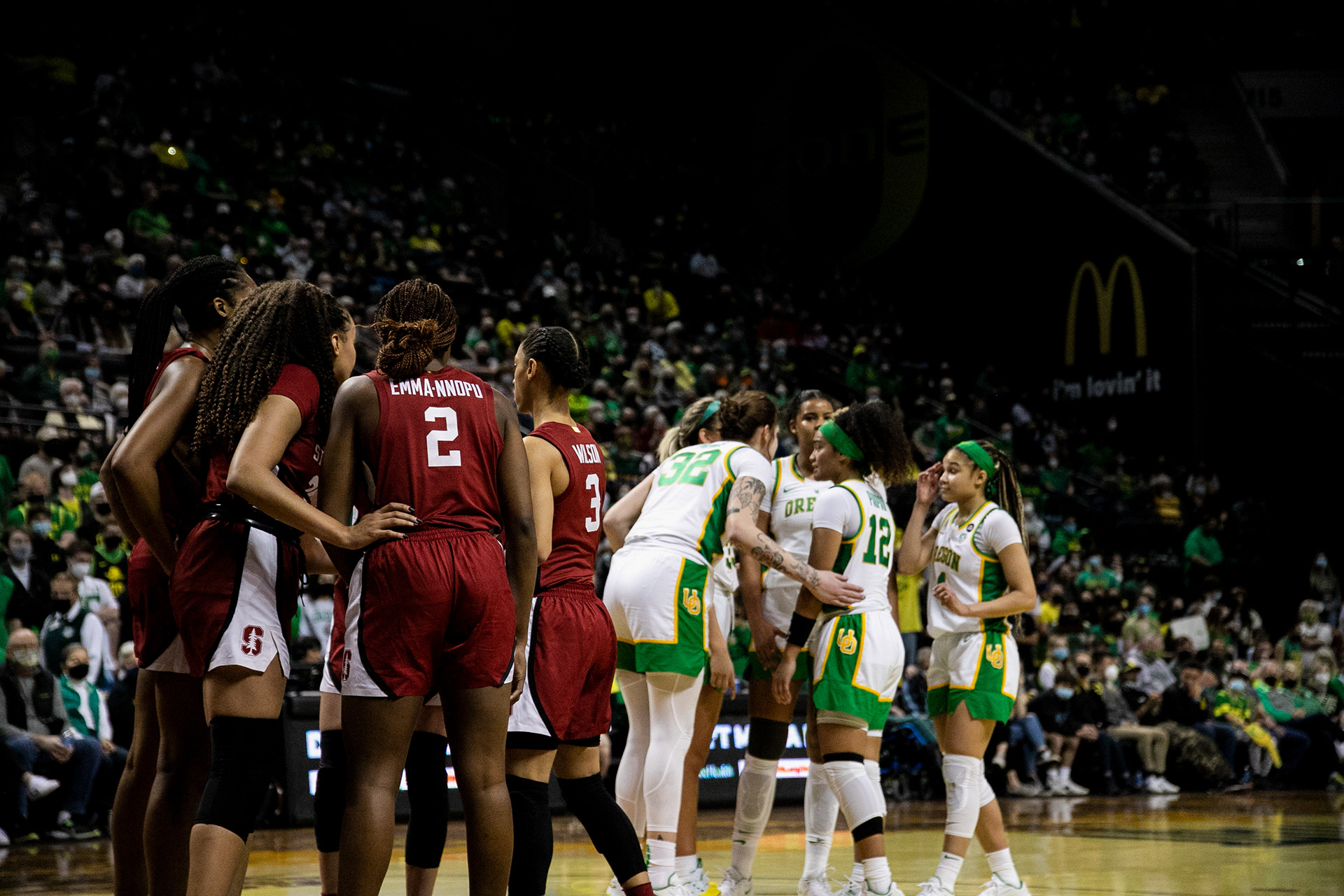 Both teams gather as Oregon plans their attack on what would be their last possession.