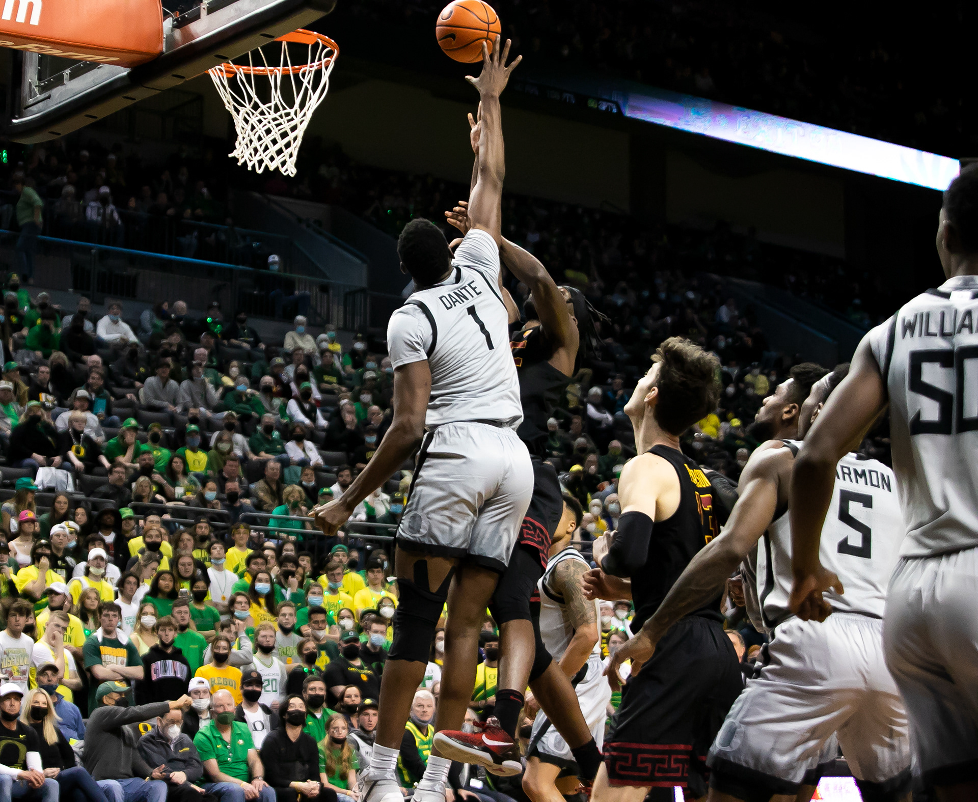 N’Faly Dante goes up for a block on the USC player.