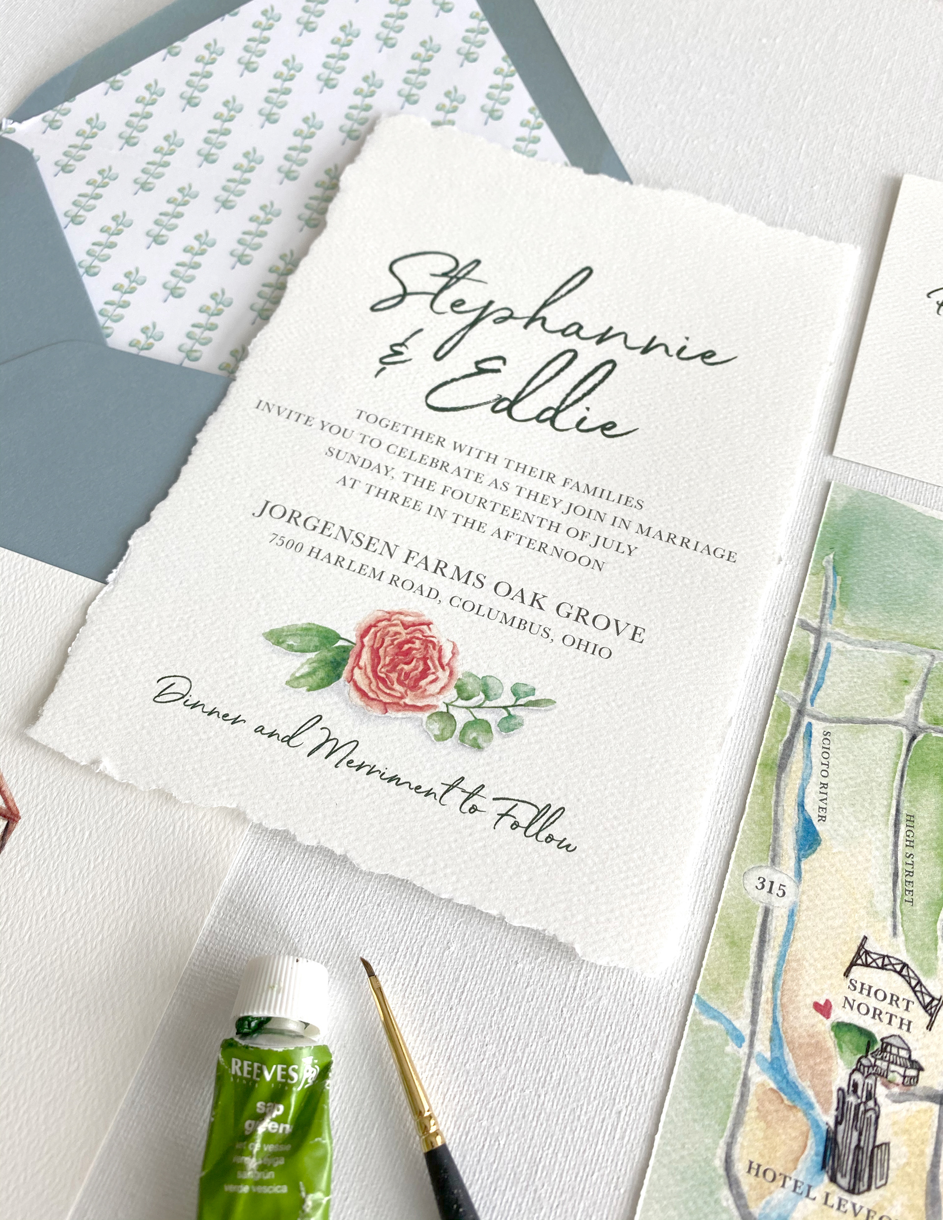 Hand-torn edges on the invitation reflected the watercolor style and romantic feel