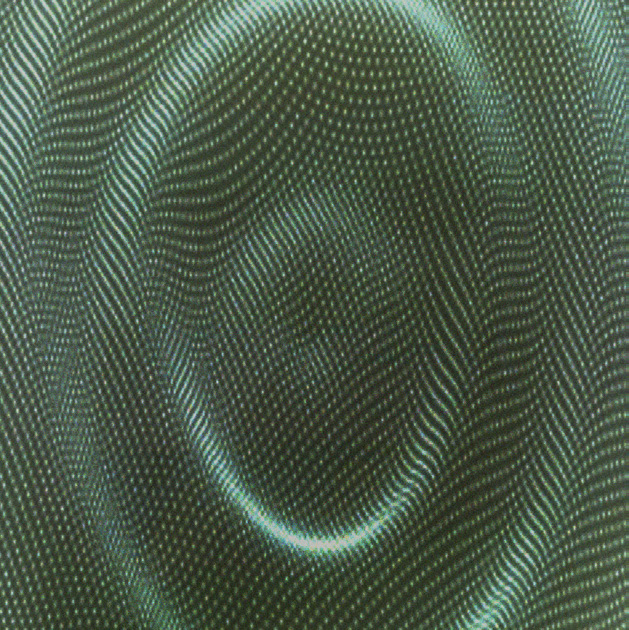 4 - Close up reveals the message formed by the vibrating particles.