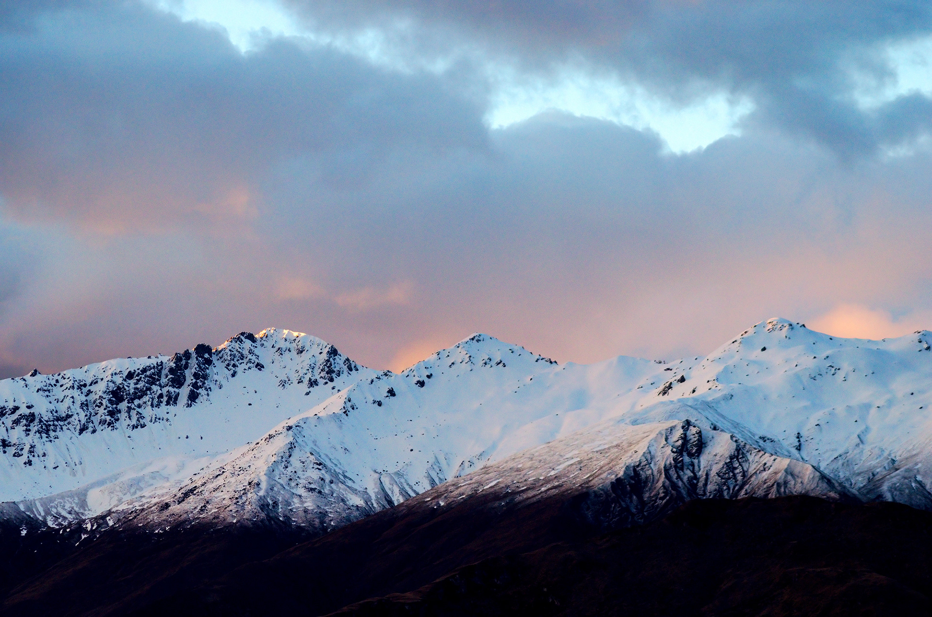 Sunset over the snow-capped Buchanan Peaks at Lake Wanaka
