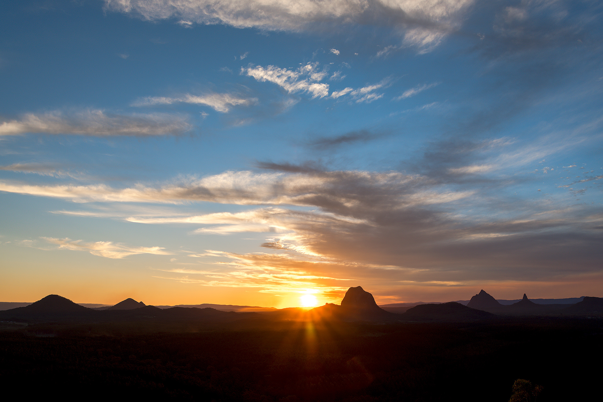 Sunset over the Glass House Mountains National Park from the Wild Horse Mountain lookout