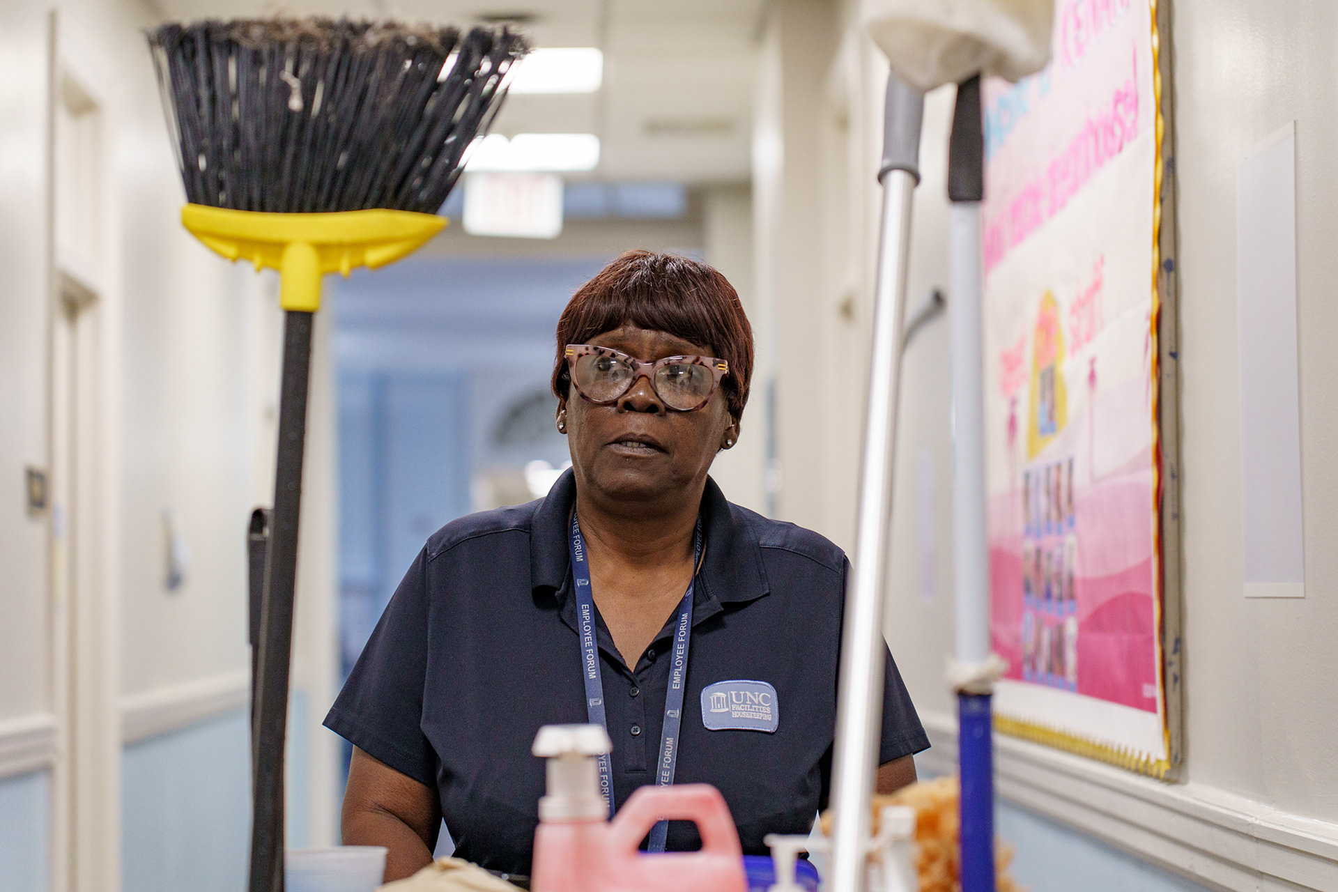 Robin Lee, 63 years old, has retirement just around the corner. She’s been working as a housekeeper at UNC Chapel Hill for the past four years, and as a state employee for the past 20. With a recent wave of understaffing, the housekeepers’ jobs have gotten harder than ever, but their pay still hasn’t risen to reflect that or the cost of living crisis. Now, Robin works from 6 to 4 Monday through Friday, and then works a second shift from 4-8 three days a week. “My body is feeling like I’m ready to retire,” she groans as she sits down one morning.