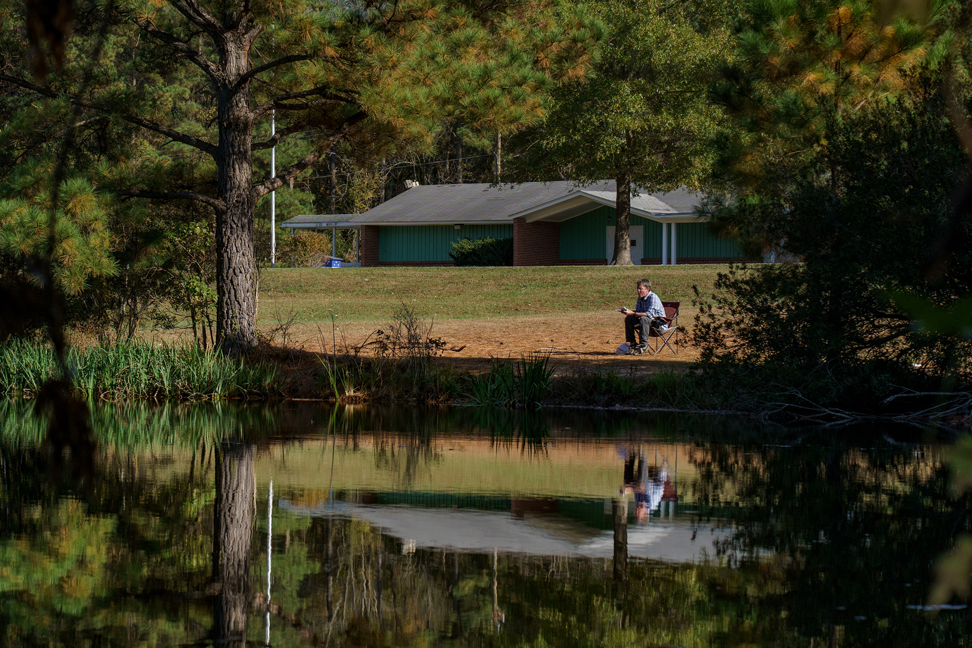 Adam eats lunch in one of the public spaces currently slated for development, which he hopes to rework if elected. “I grew up just a little way away from here, we’d come out here all the time,” he says. “Every time I come out here I think about it. If we get a majority, we can reverse this vote.” The public land is not officially designated as a park, so it goes largely unused.