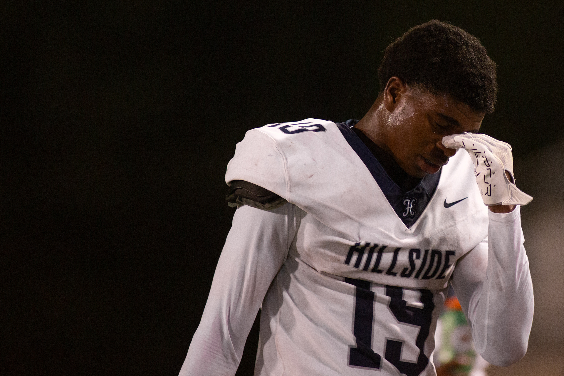 Hillside's victory didn't last for long. After winning the season opener, Hillside proceeded to lose their next four games. Hillside senior RB Desmond Smith (19) buries his head in his hands during one of those losses after failing to reach first down on a drive. "Early in the season, we made a lot of mistakes," said Coach Nowell.