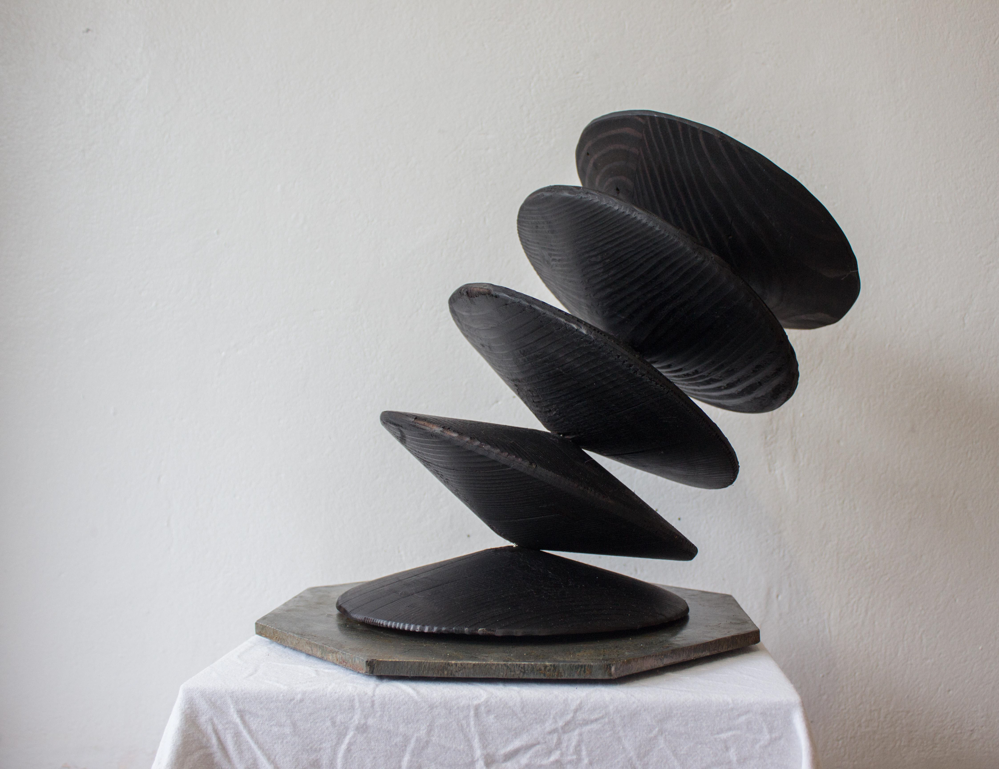 Timbr tension invites the audience to touch and rotate the timber discs to change the artworks form