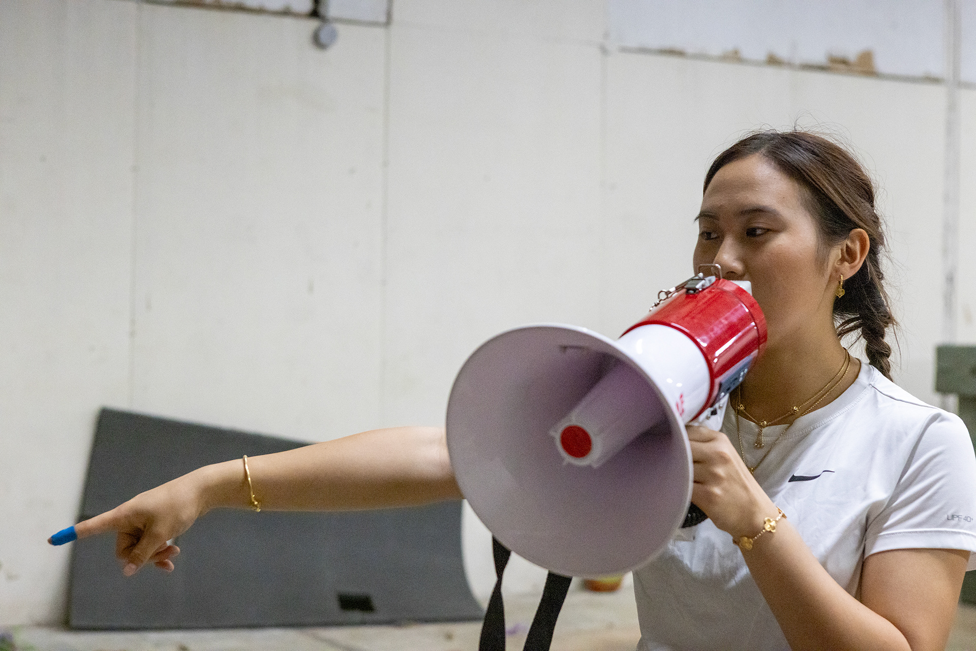 JL Lion Dance co-caption Emily Chea instructs other members through their practice routines in Garland, Texas on Oct. 18, 2025.