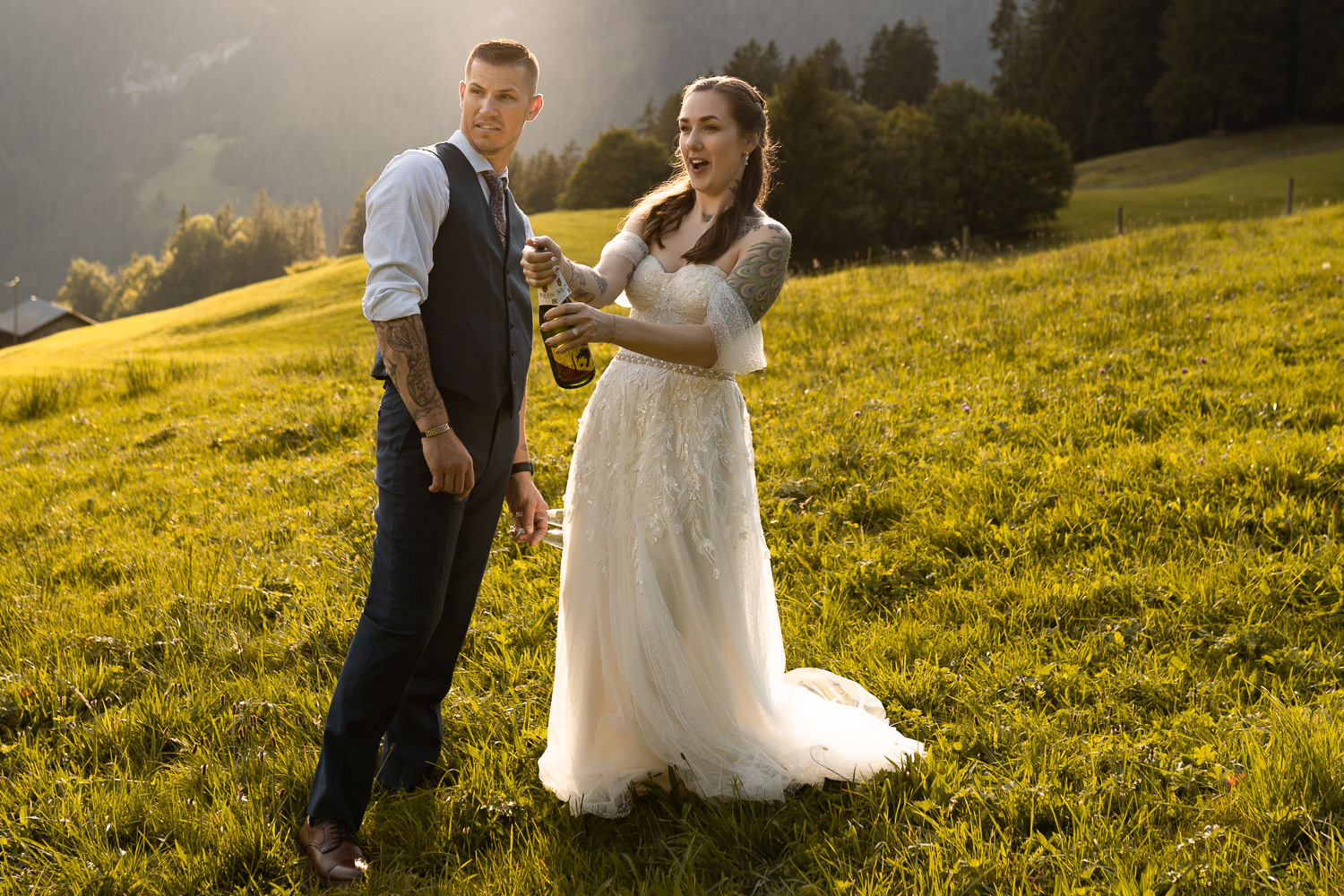 Bride opening champagne during her wedding in Switzerland in Bern area