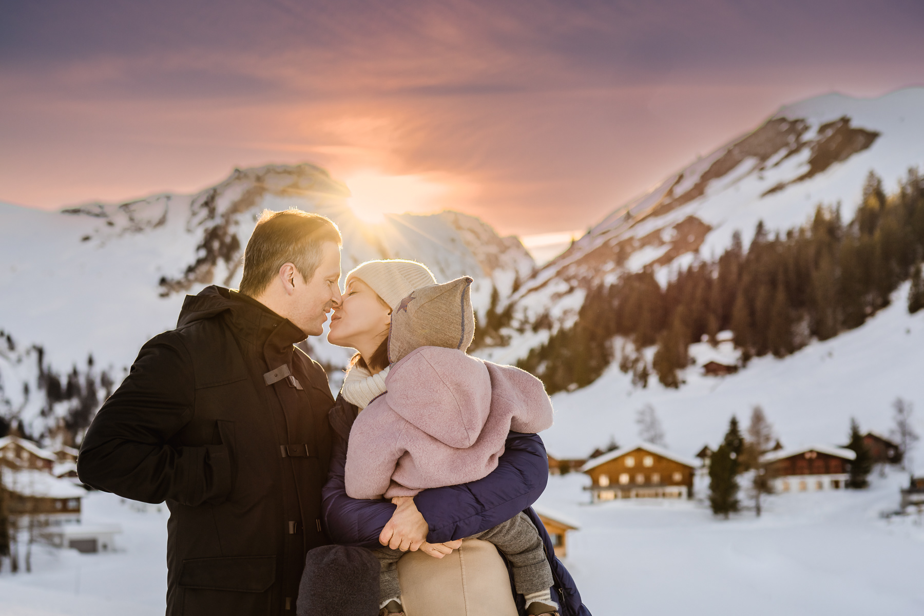 family photo taken during winter ski holidays in Switzerland in Zermatt