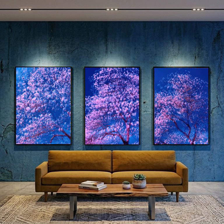 Abstract nature photography featuring a rhythmic movement of pink and blue hues, ethereal dreamscape of a blooming tree created through multiple exposure and camera motion
