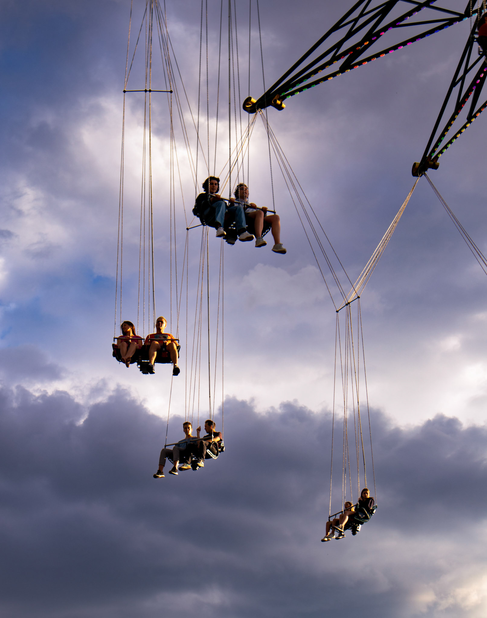 People ride at dusk