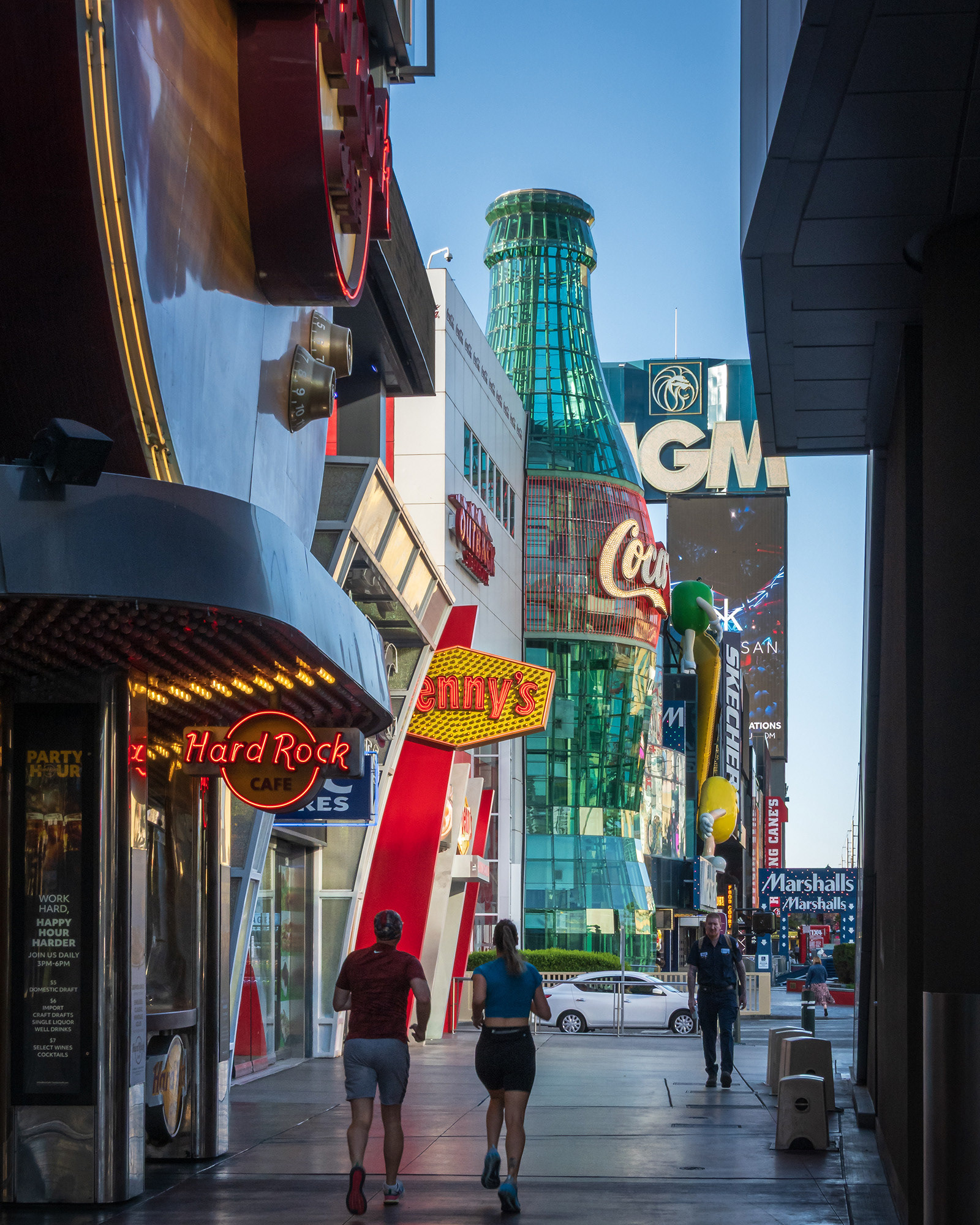 Joggers and pedestrians on Las Vegas Boulevard in the early morning