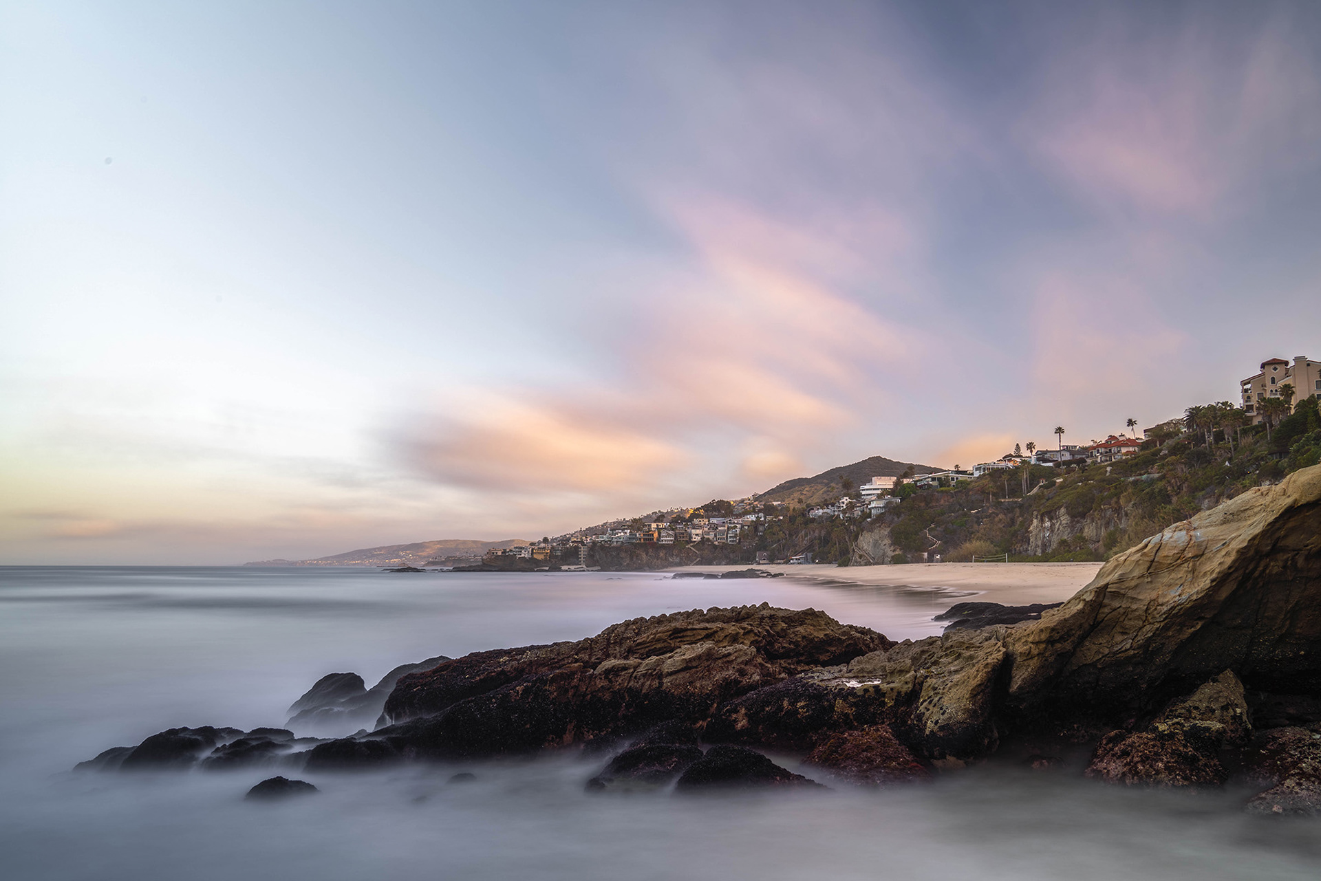 California beach long exposure seascape on a sunny morning with light clouds