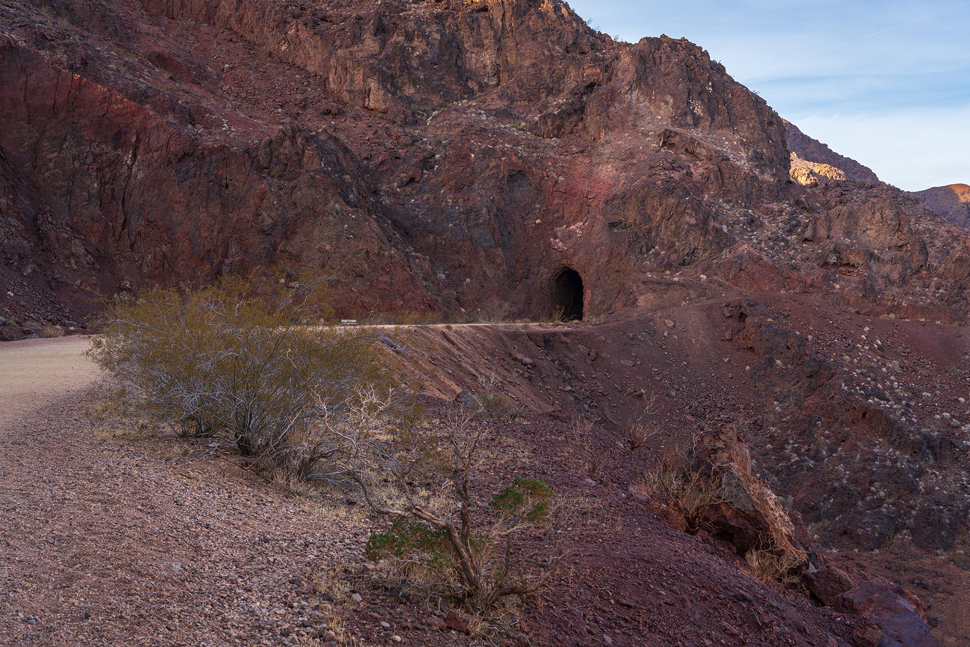 Landscape vista showing on the historic railroad trail showing a levee curving around to a tunnel