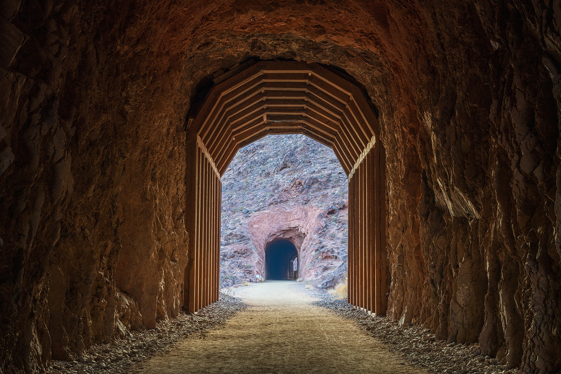 Landscape image showing the timber cladding at a tunnel entrance on the historic railroad trail