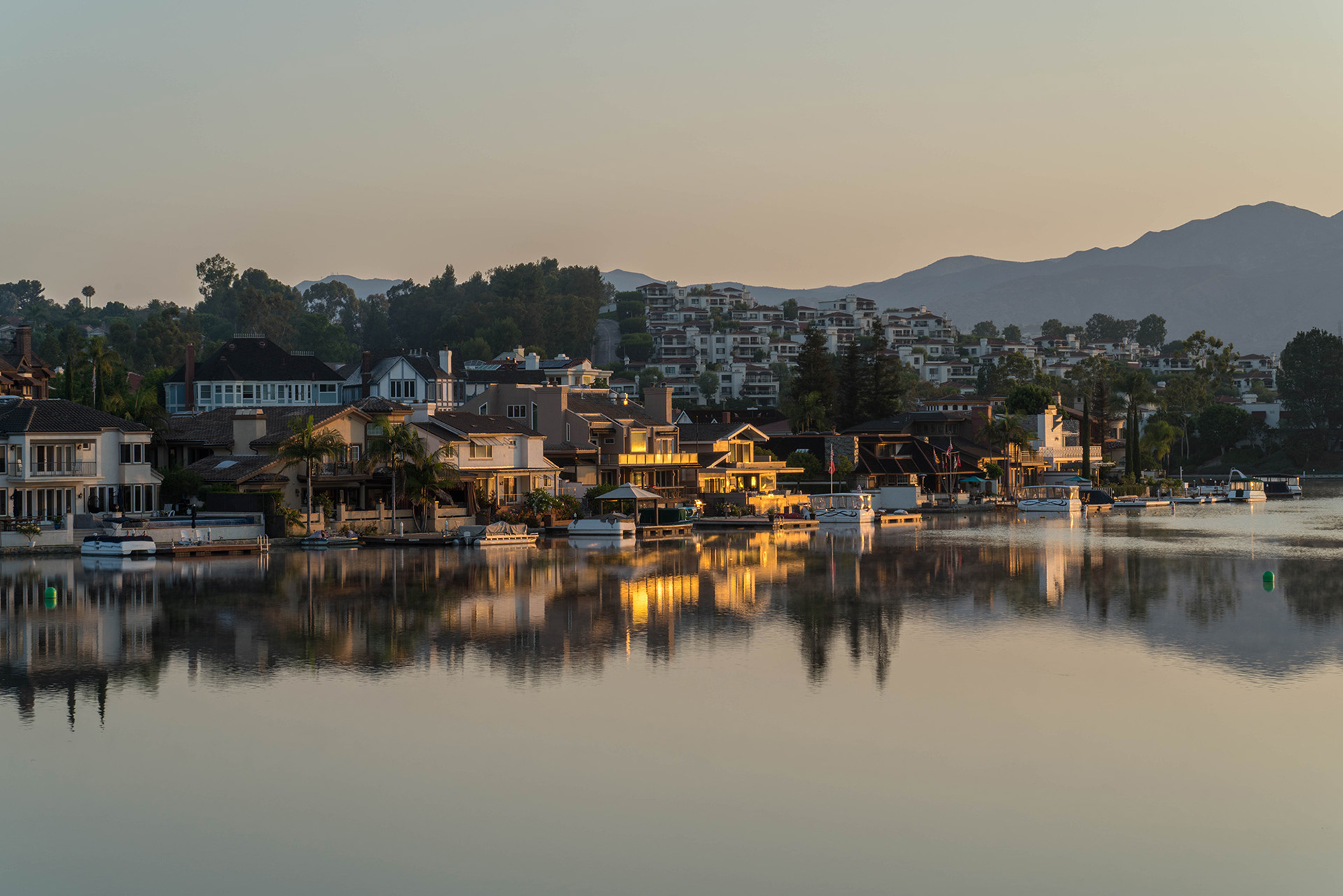 California landscape showing reflections in the calm waters of a lake at sunrise