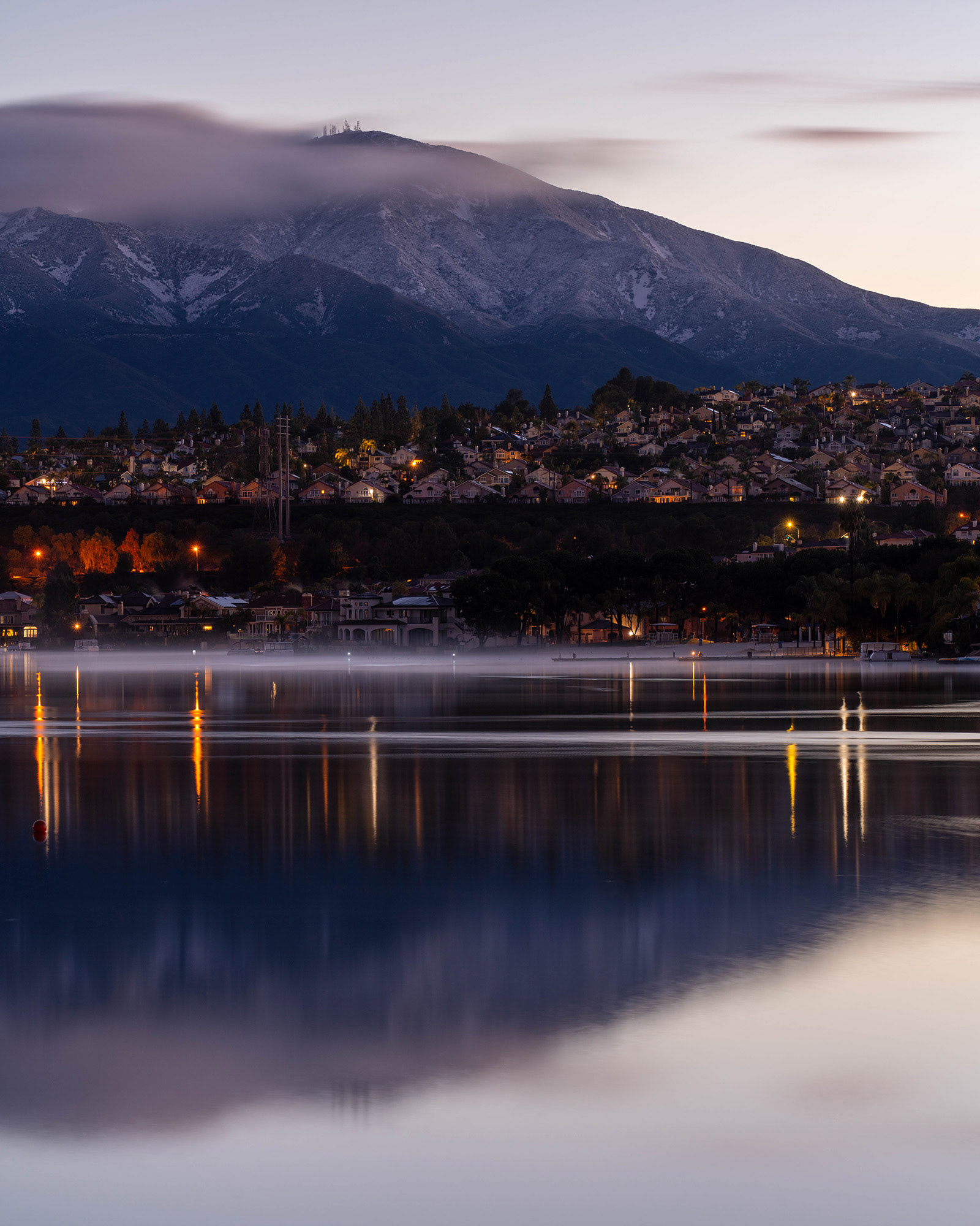 California landscape showing wintry reflections in the calm water of a lake