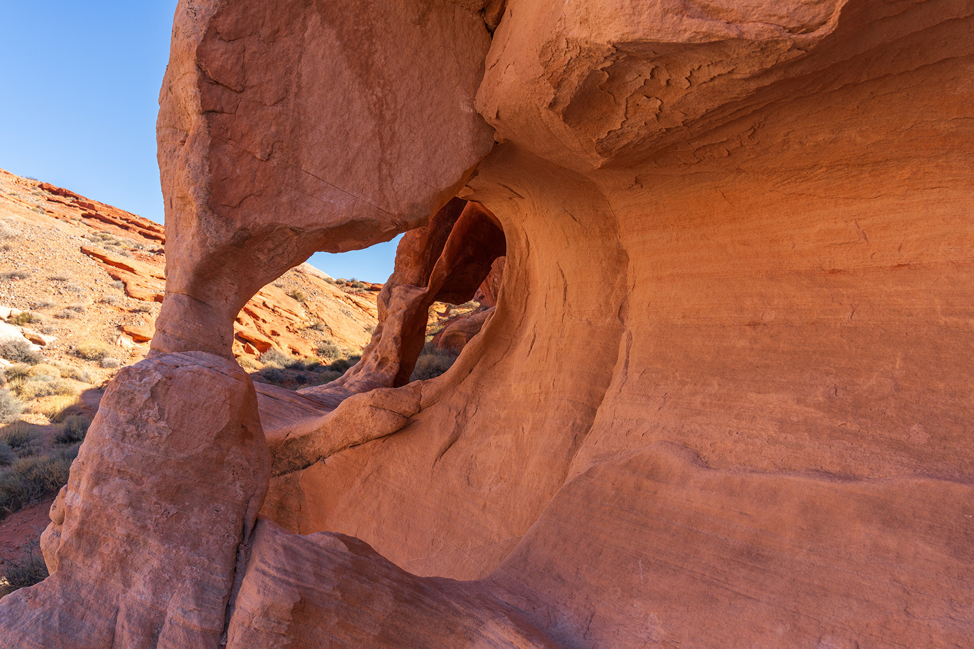 Pastel sandstone rock arched sculpture shaped by erosion
