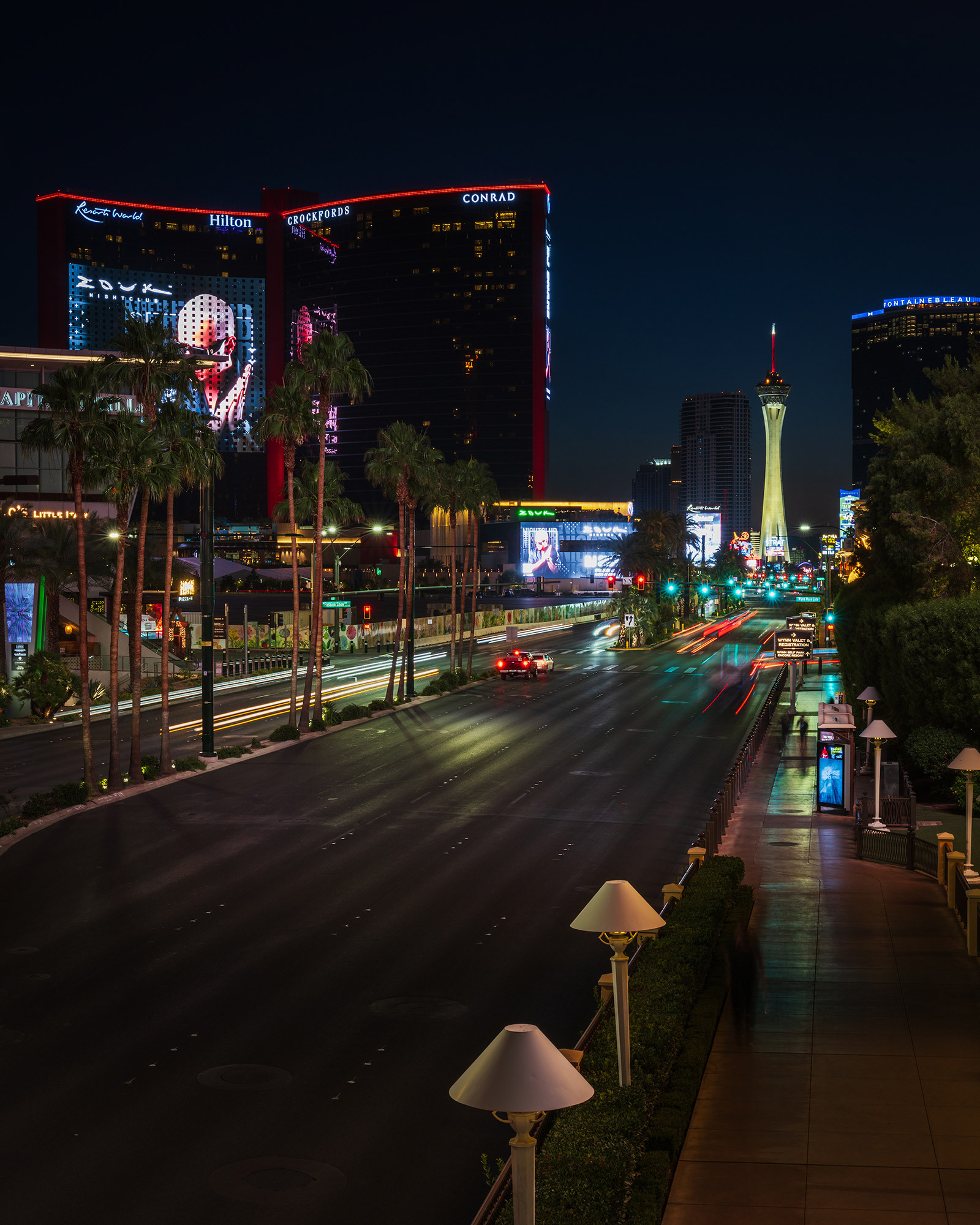 Looking up Las Vegas Boulevard towards the Strat casino and hotel buildings early in the morning before sunup