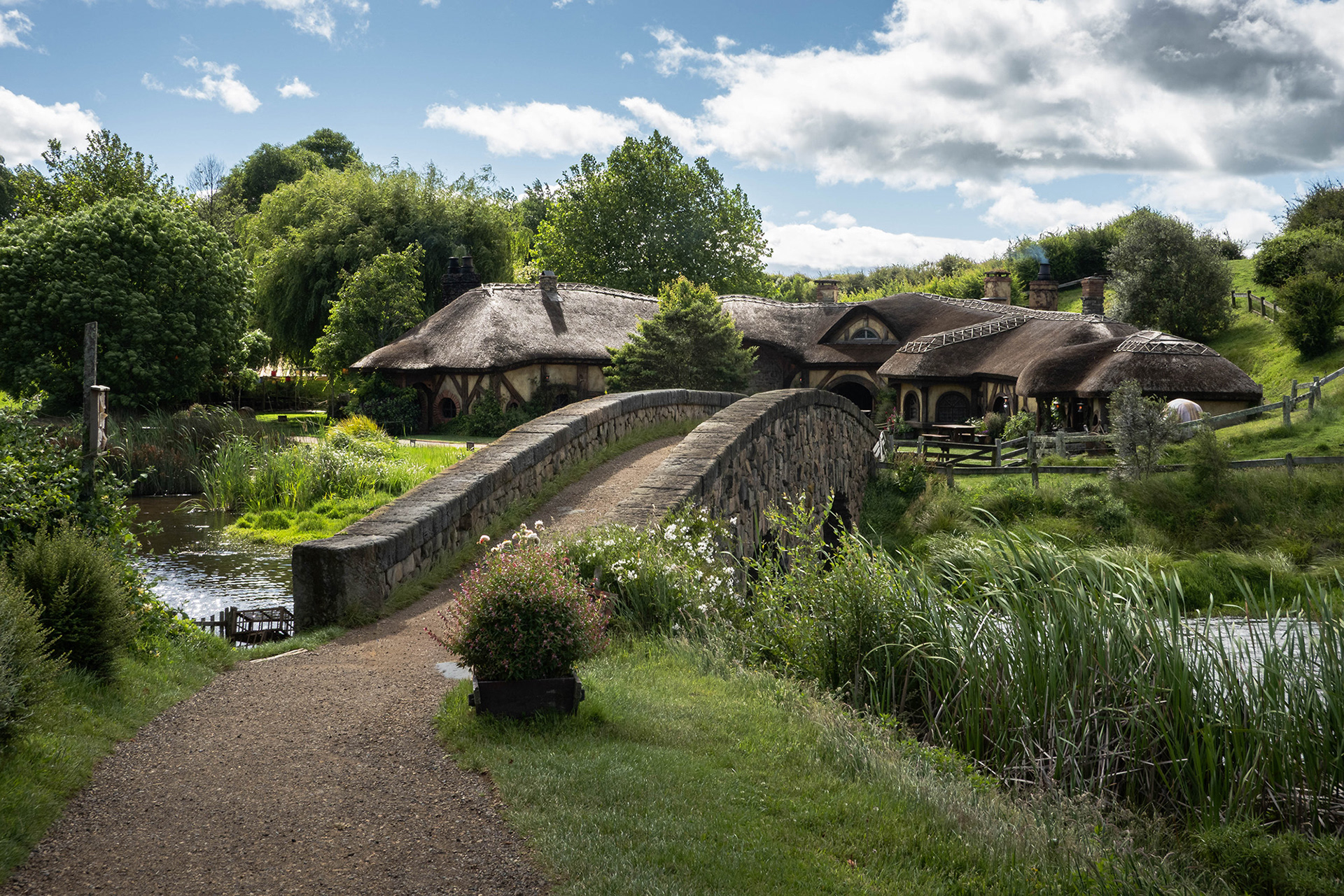 The stone bridge traversing the lake with the Green Dragon Inn on the far side