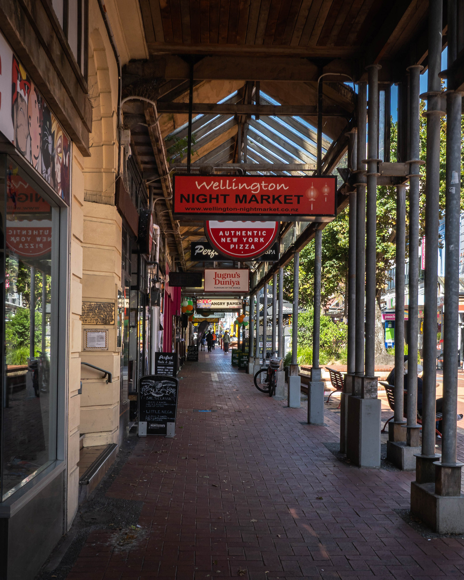 View of Cuba Street in Wellington showing the covered awnings above the pavement in what is clearly a "foodie" part of town