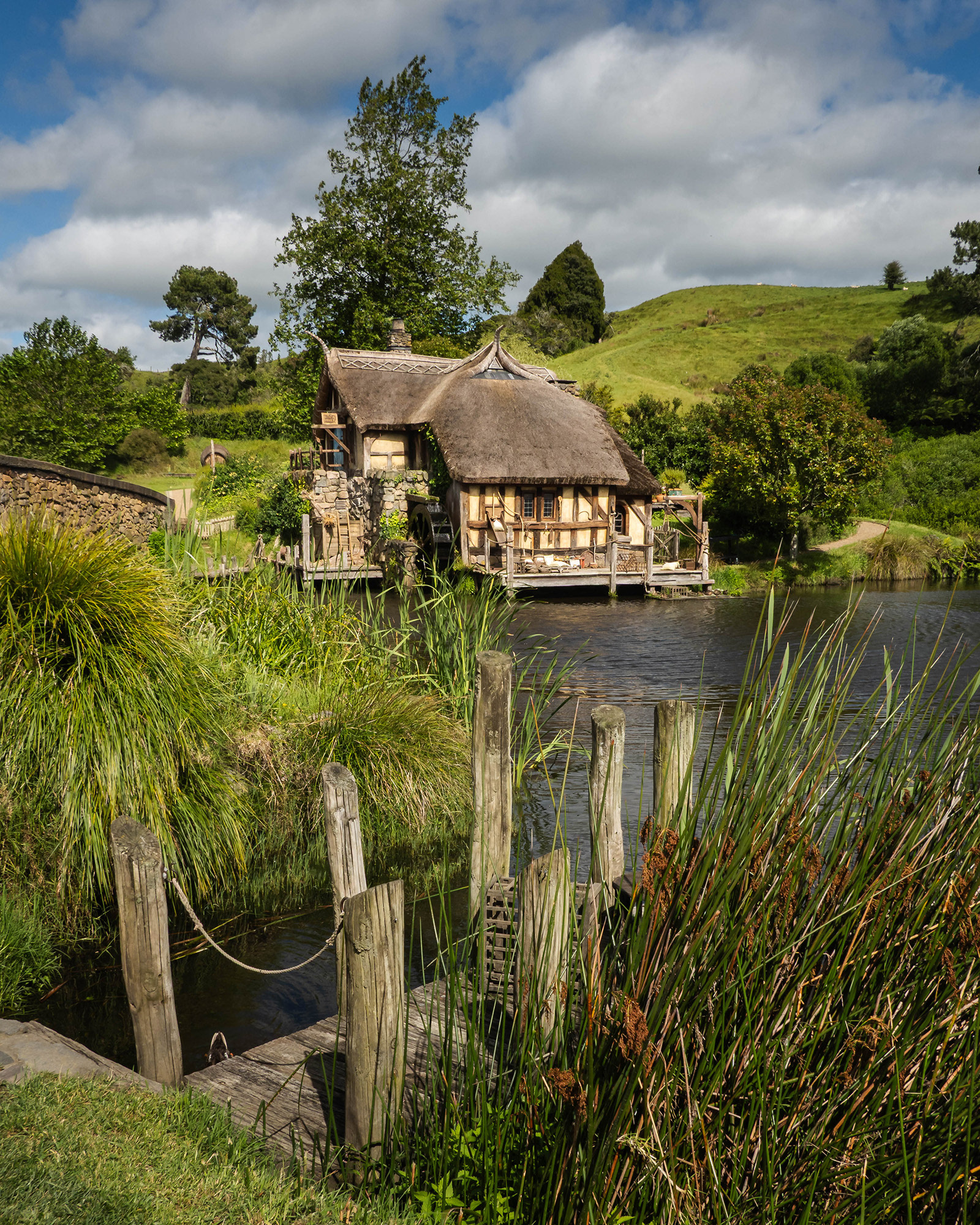 View of the watermill from the wooden jetty by the Green Dragon Inn