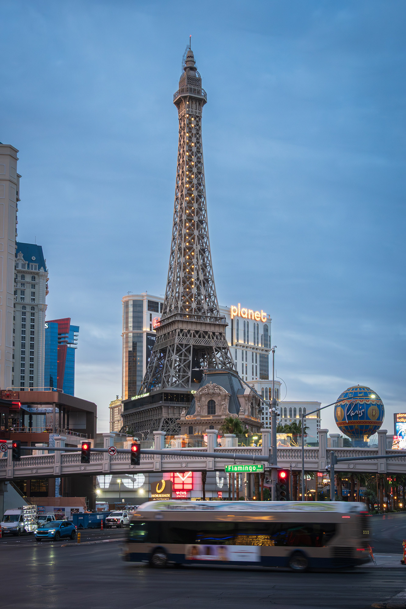 Bus crossing the Las Vegas Strip by the Paris Eiffel Tower early in the morning