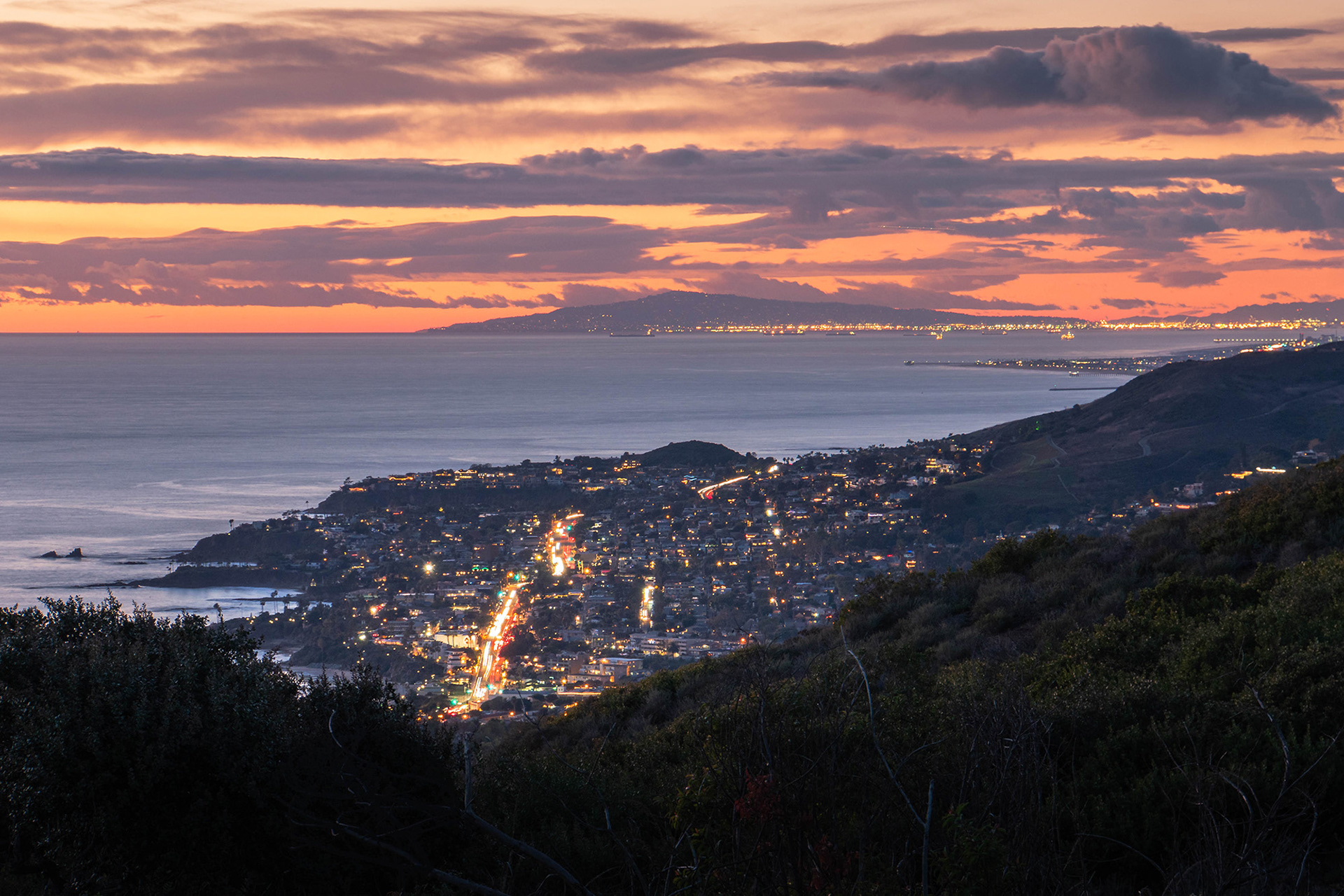 California seascape post sunset showing Laguna Beach with the coastline stretching up to Los Palos Verdes in the background