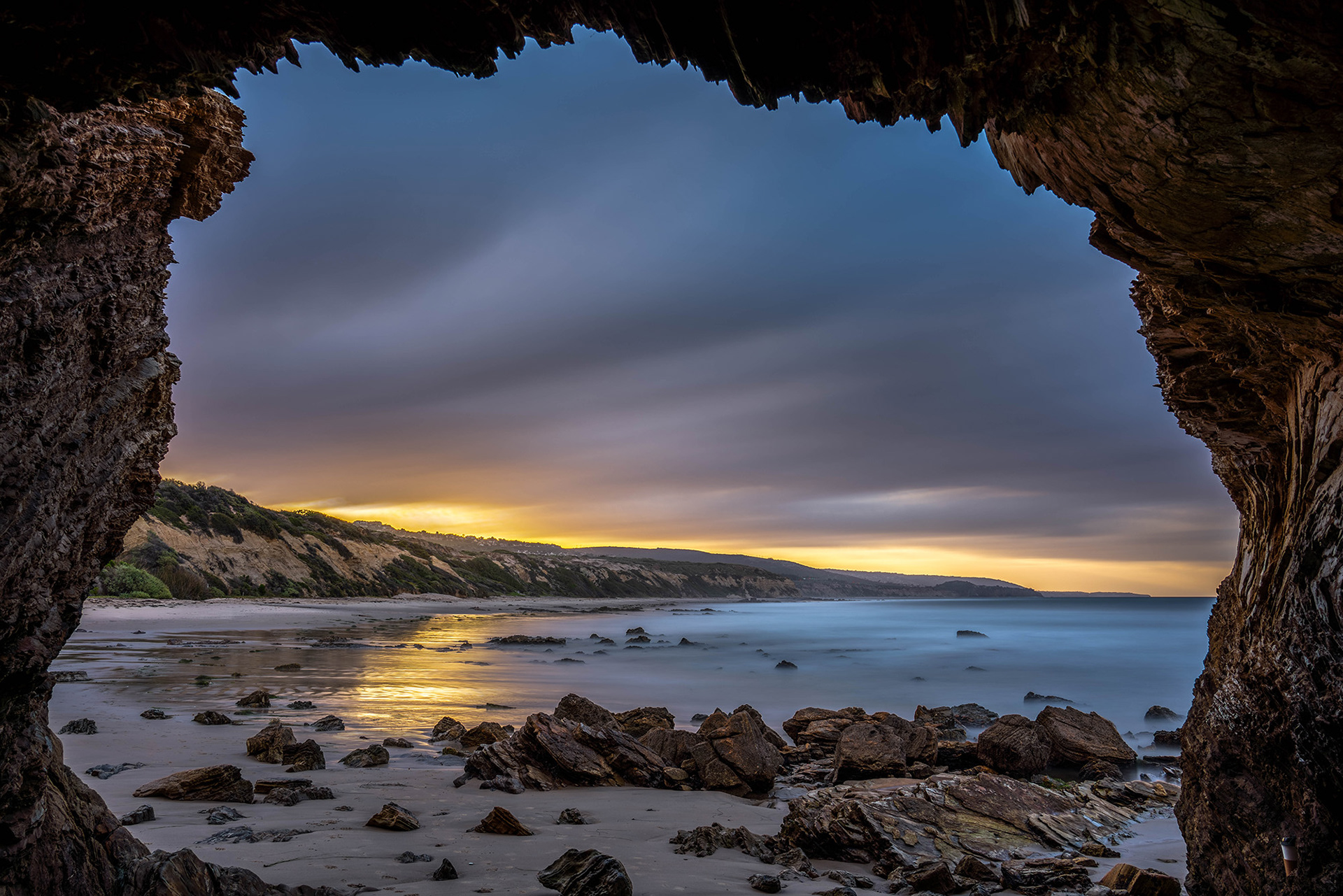 California seascape of a beach cave at dawn