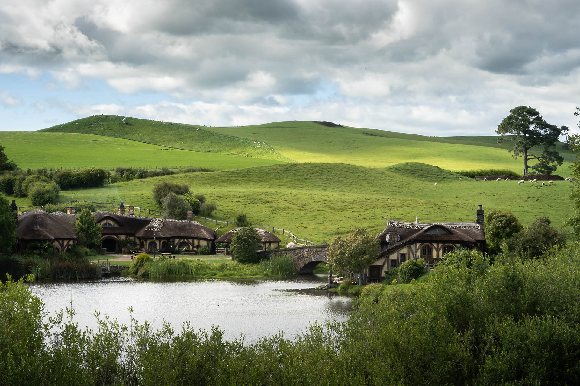View looking down at the Green Dragon Inn and watermill by the lake