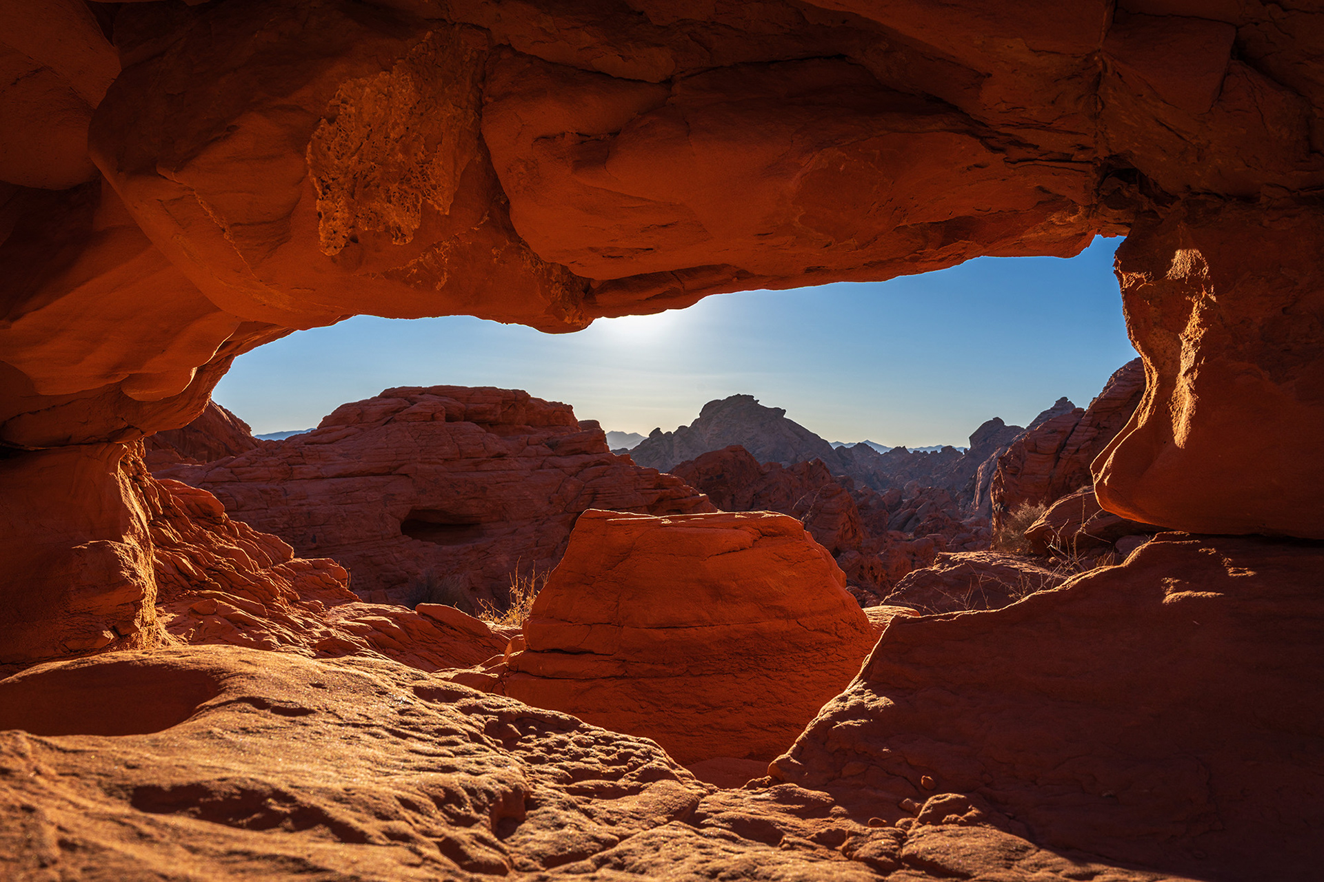 View through the arch which overlooks the Fire Canyon in the early morning sun