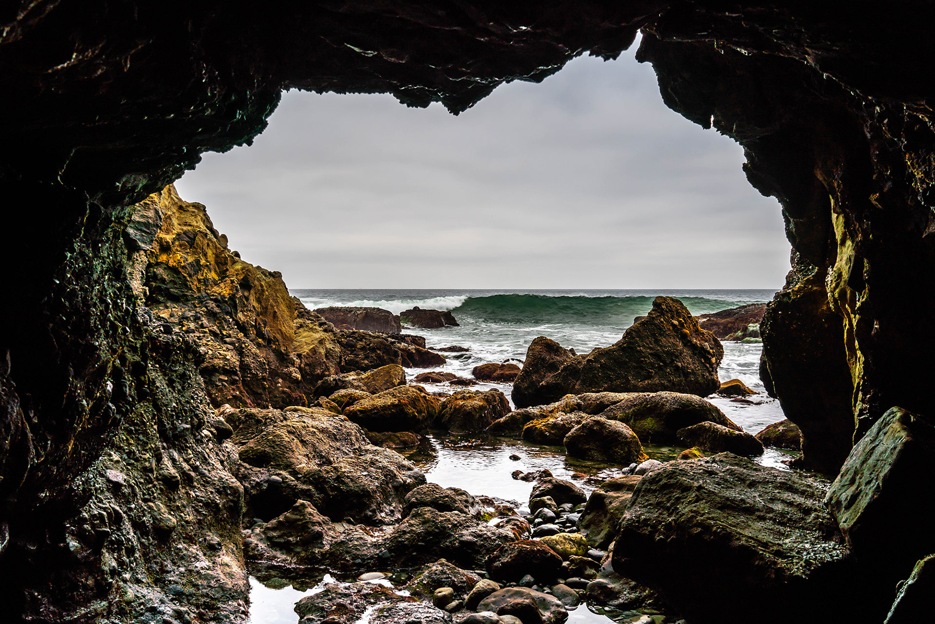 California seascape of surf from sea caves