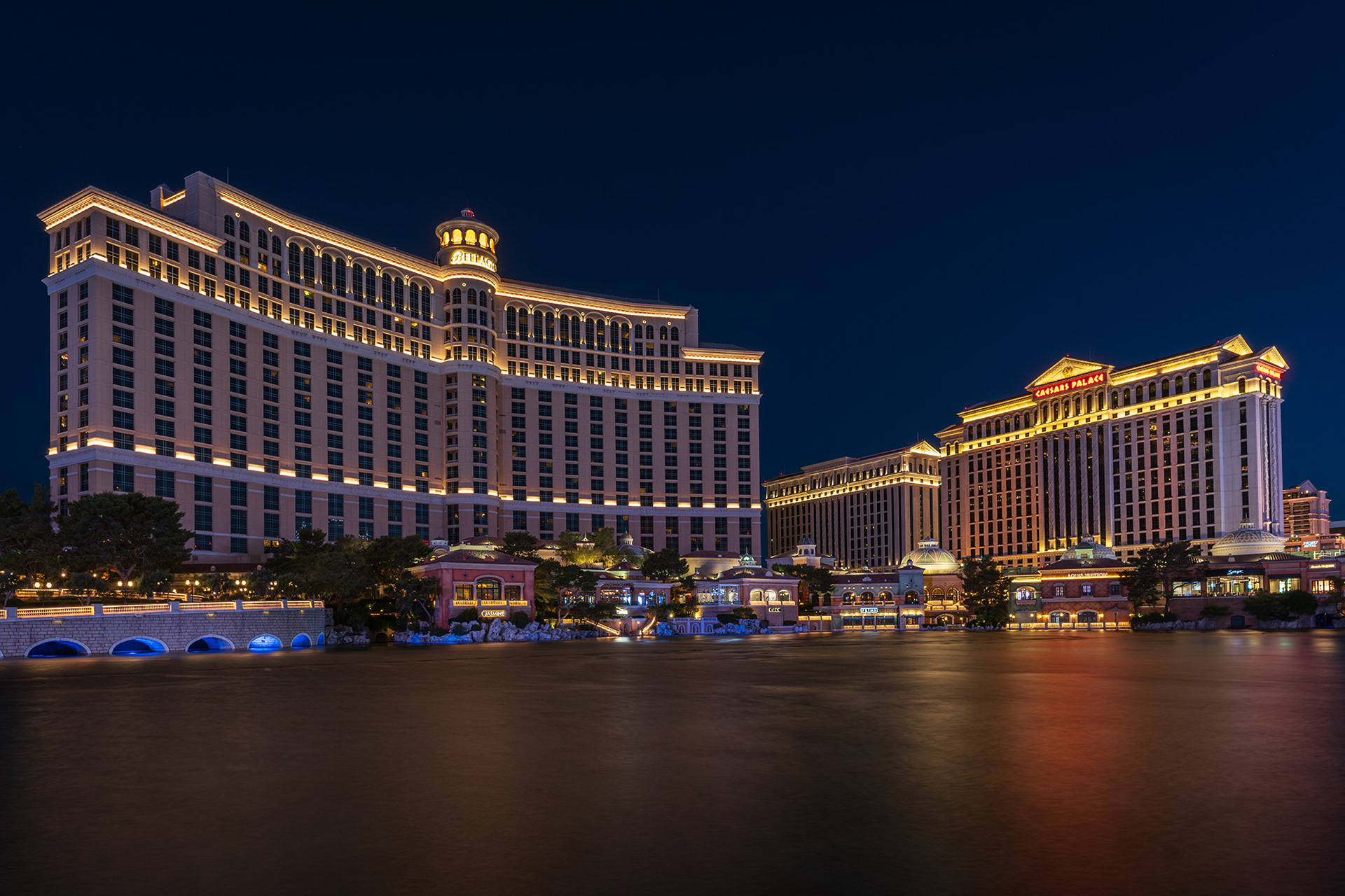 Looking over the Bellagio lake towards the Bellagio and Caesar's Palace hotels early morning pre-dawn