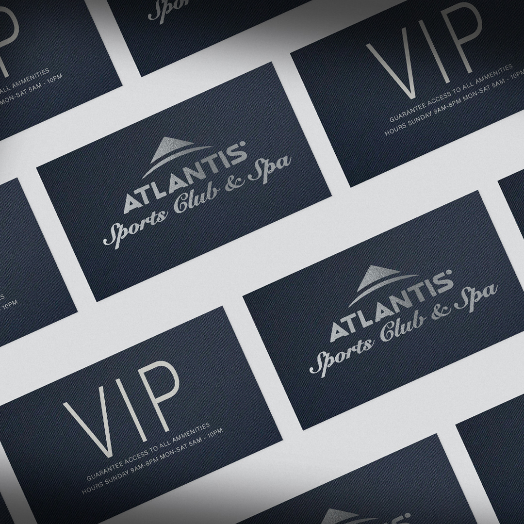 Premium business cards with silver foil on navy card stock.