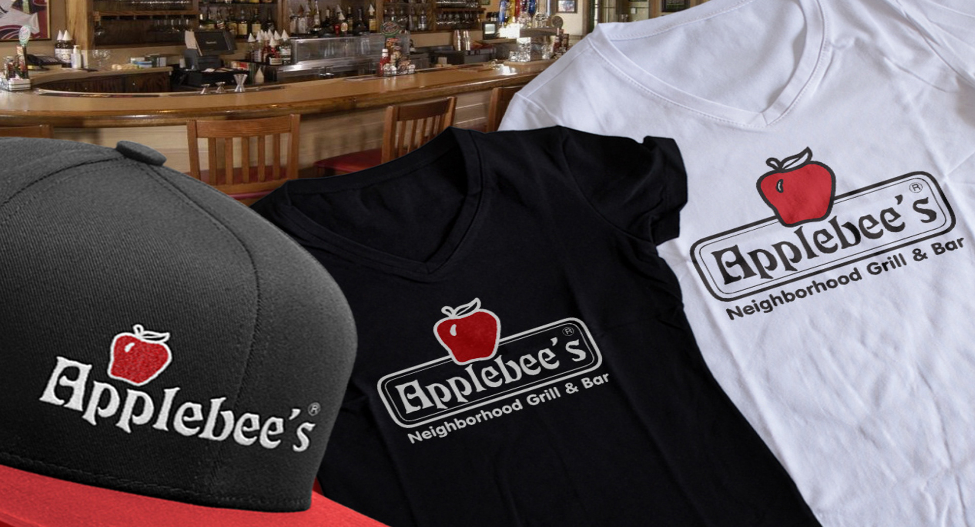 Matching branded apparel with digitized Applebee’s logo screen printed on tees and embroidered on visors.