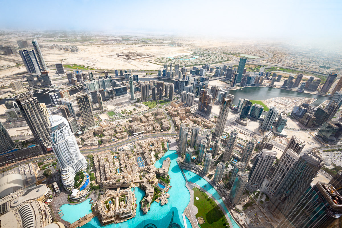 Downtown Dubai from the 148th floor of the Burj Khalifa. The famous fountains are below. The fountains and water show were modeled after the Bellagio Fountains in Las Vegas.