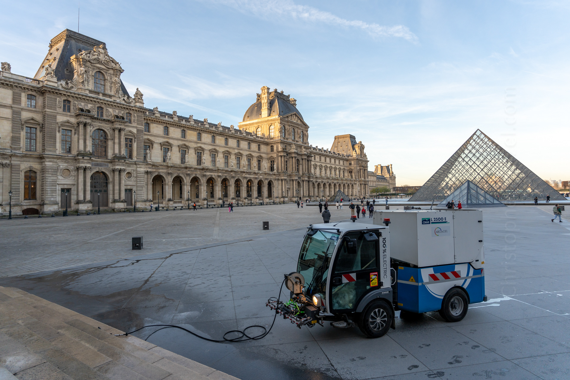 Early morning in the pyramid courtyard at the Louvre.