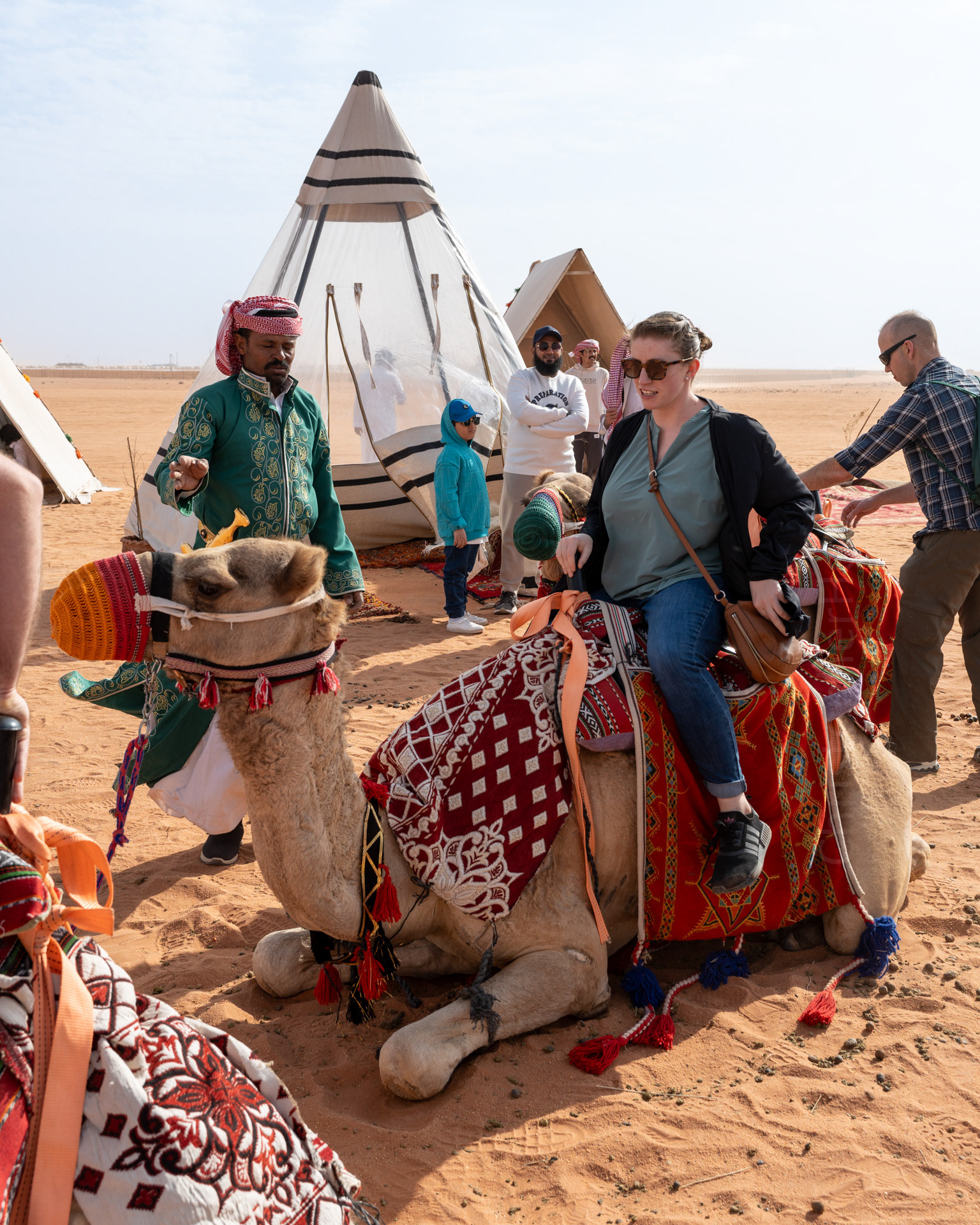 Getting on a camel.