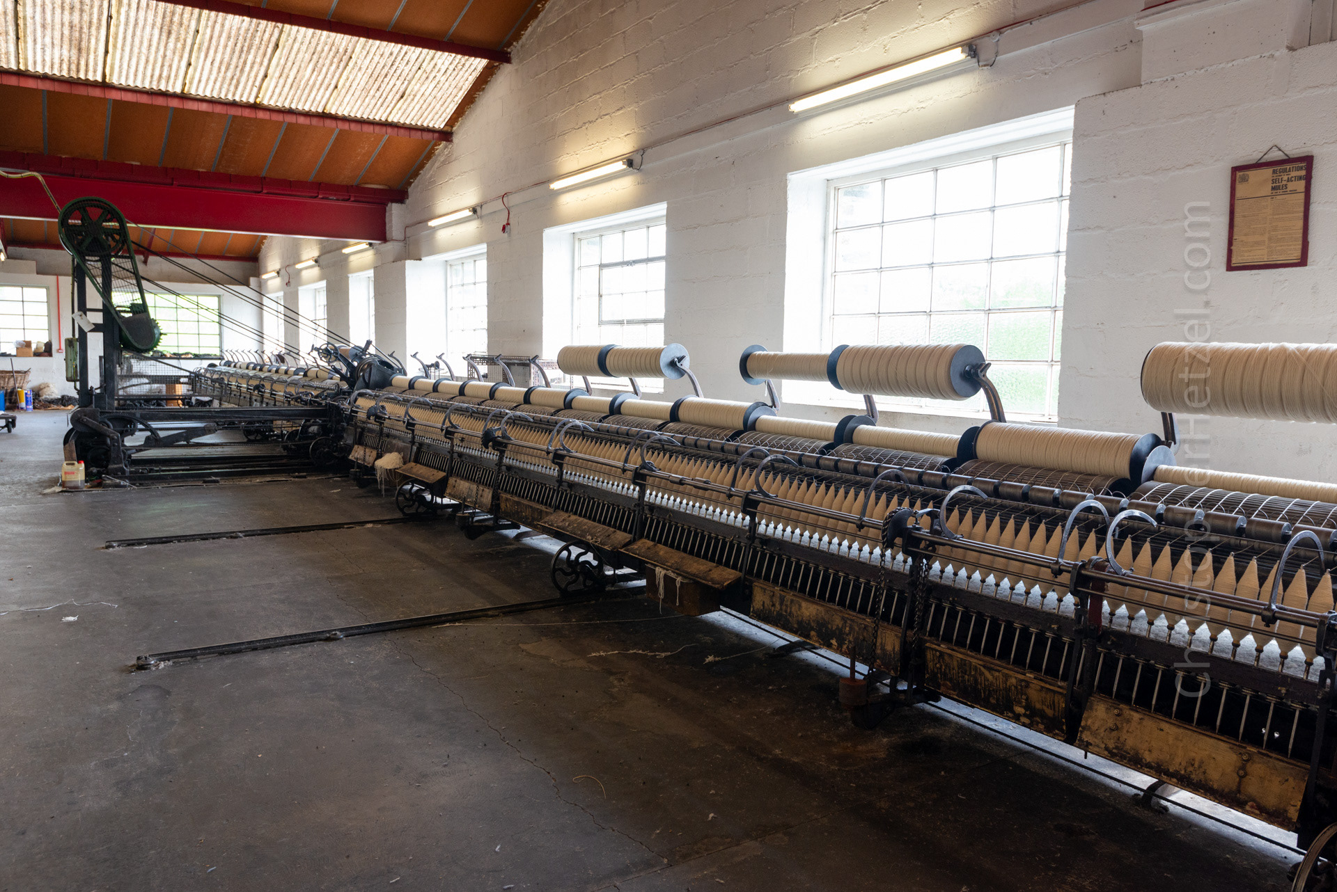 Spinning - After being carded, the 'slivers' are spun on the spinning mules, where they are stretched and twist is added, thus making thread.