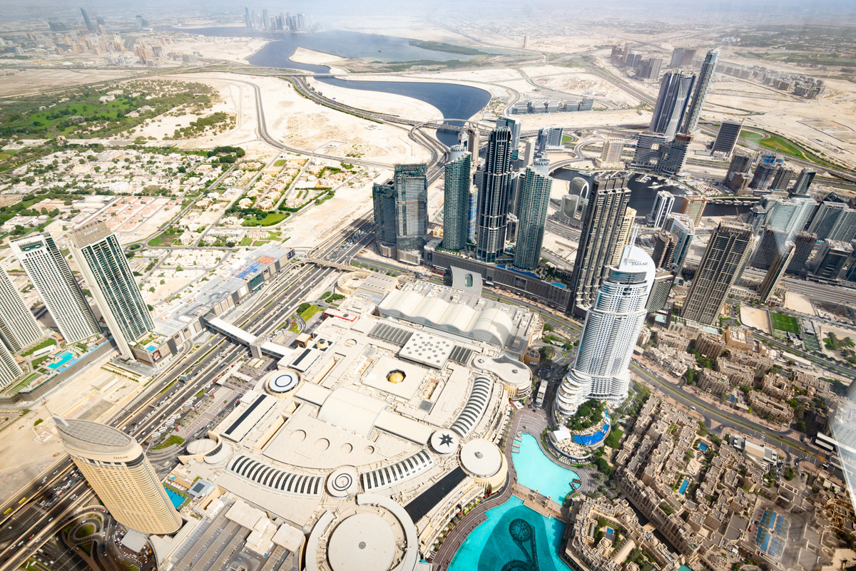 Downtown Dubai from the 148th floor of the Burj Khalifa. The roof of the Mall of Dubai is in the foreground.