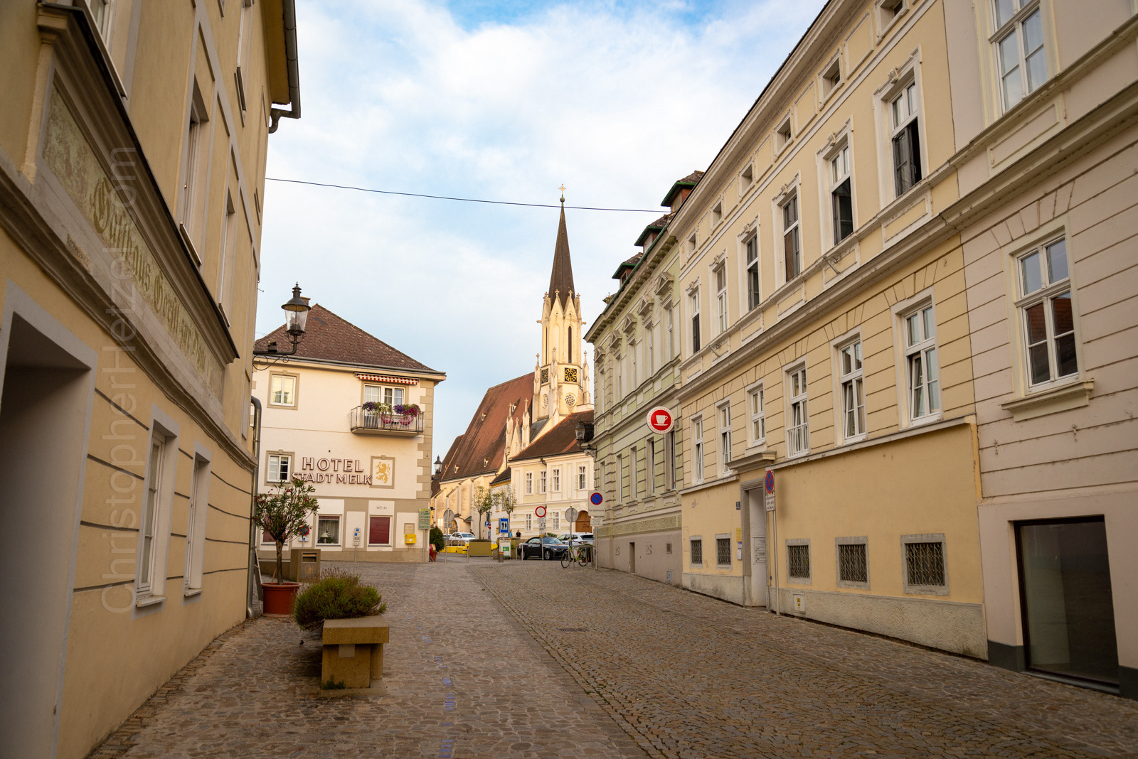Passing through the town from the river to the town square.