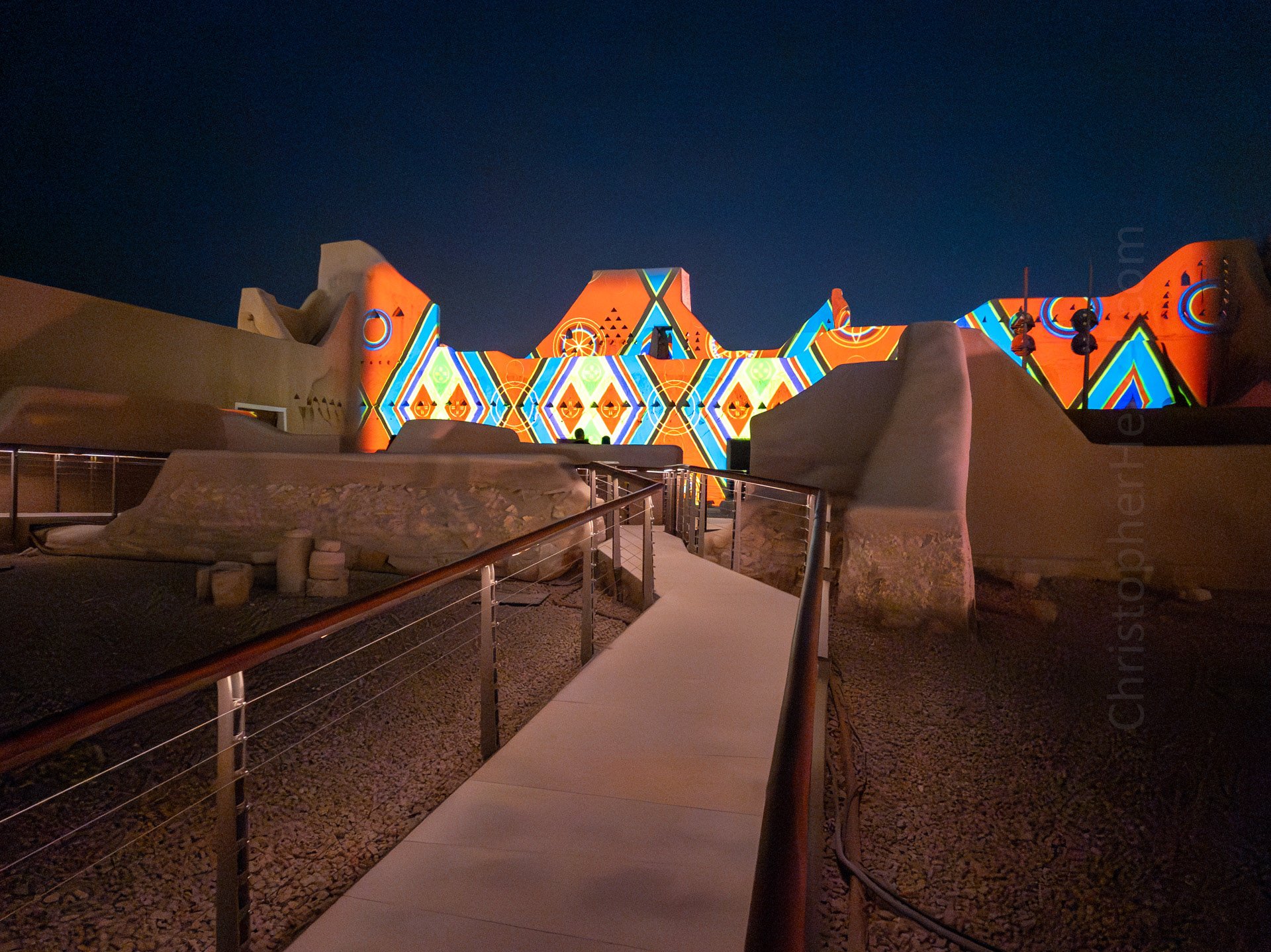 Palace of Imam Abdullah bin Saud. There was a colorful lightshow being project on the palace's outer walls. The palace belonged to Imam Abdullah bin Saud who was crowned after the death of his father, Imam Saud Alkabeer. His reign lasted 4 years from AD 1814 to 1818. The palace has an area of 2,000 square meters, consisting of three main sections, various guest rooms and meeting halls, accommodation for servants and guardians, a warehouse for ammunition and weapons, a warehouse for supplies, a horse stall and livestock barns. Today, it houses At-Turaif's social life museum.