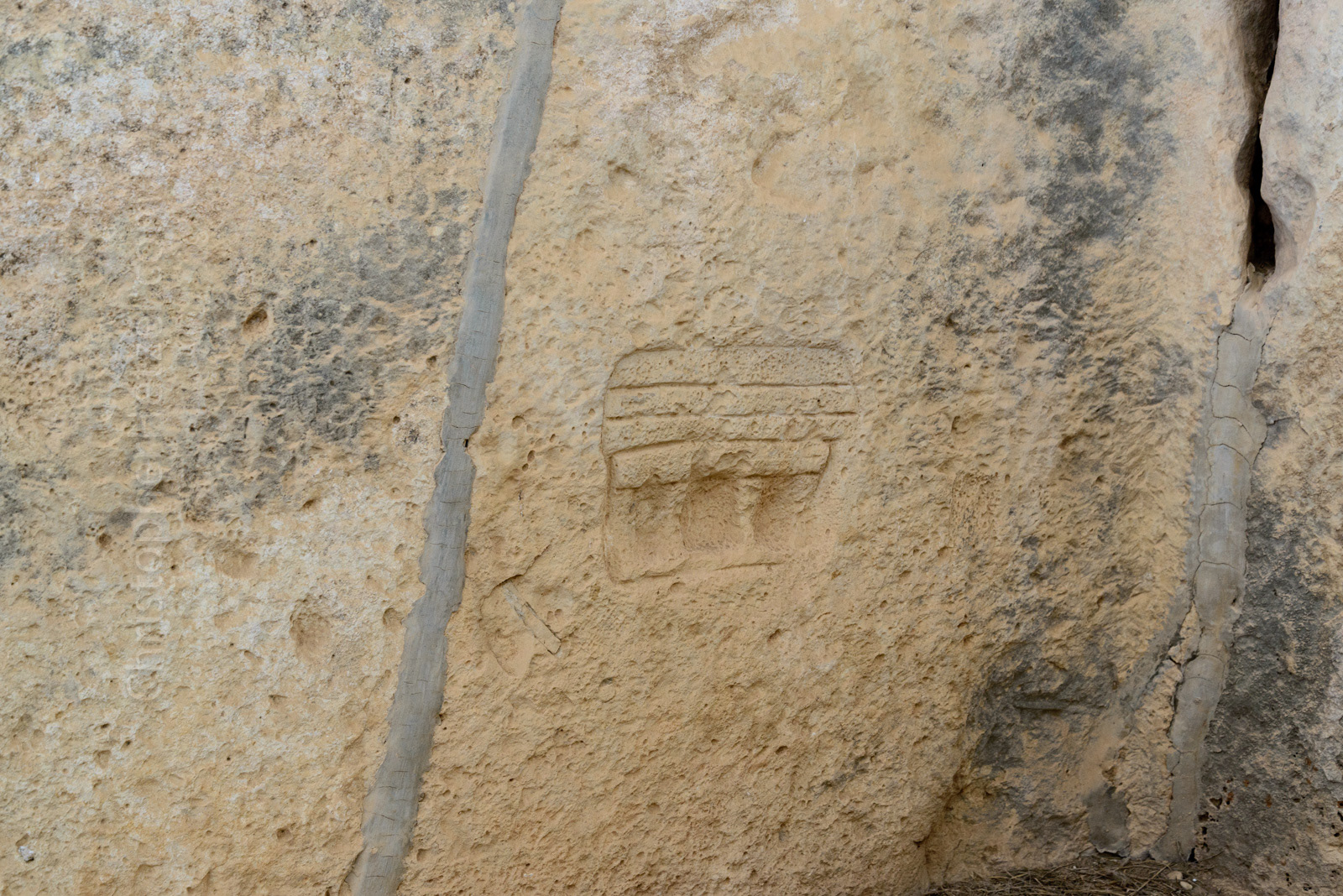 Rare Neolithic period carving, depicting the facade of a Mnajdra temple, showing its roof structure.