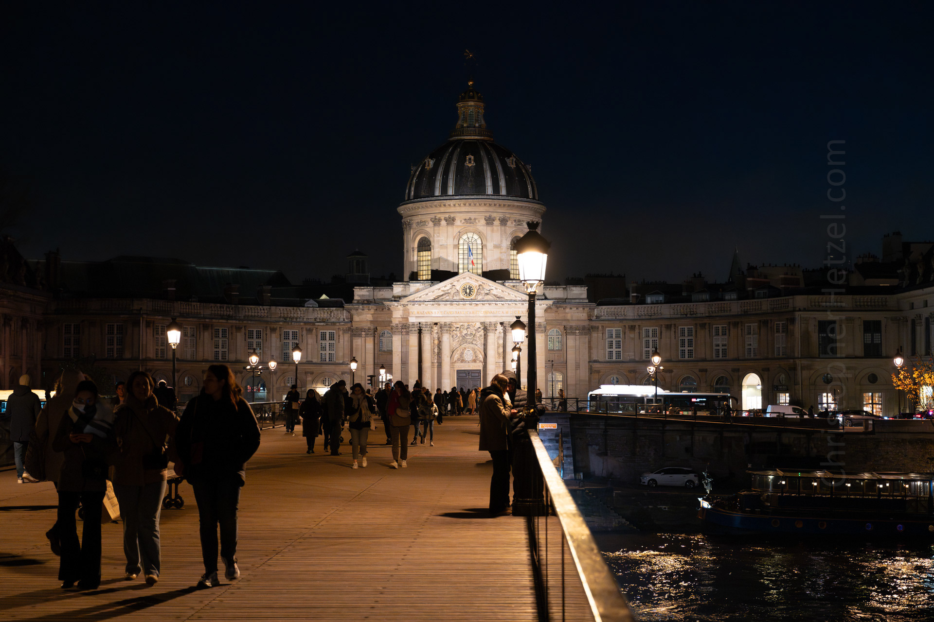 The Institut de France, established in 1795, is visible through the portal. The building was originally constructed as the Collège des Quatre-Nations, as a school for students from new provinces attached to France under Louis XIV.