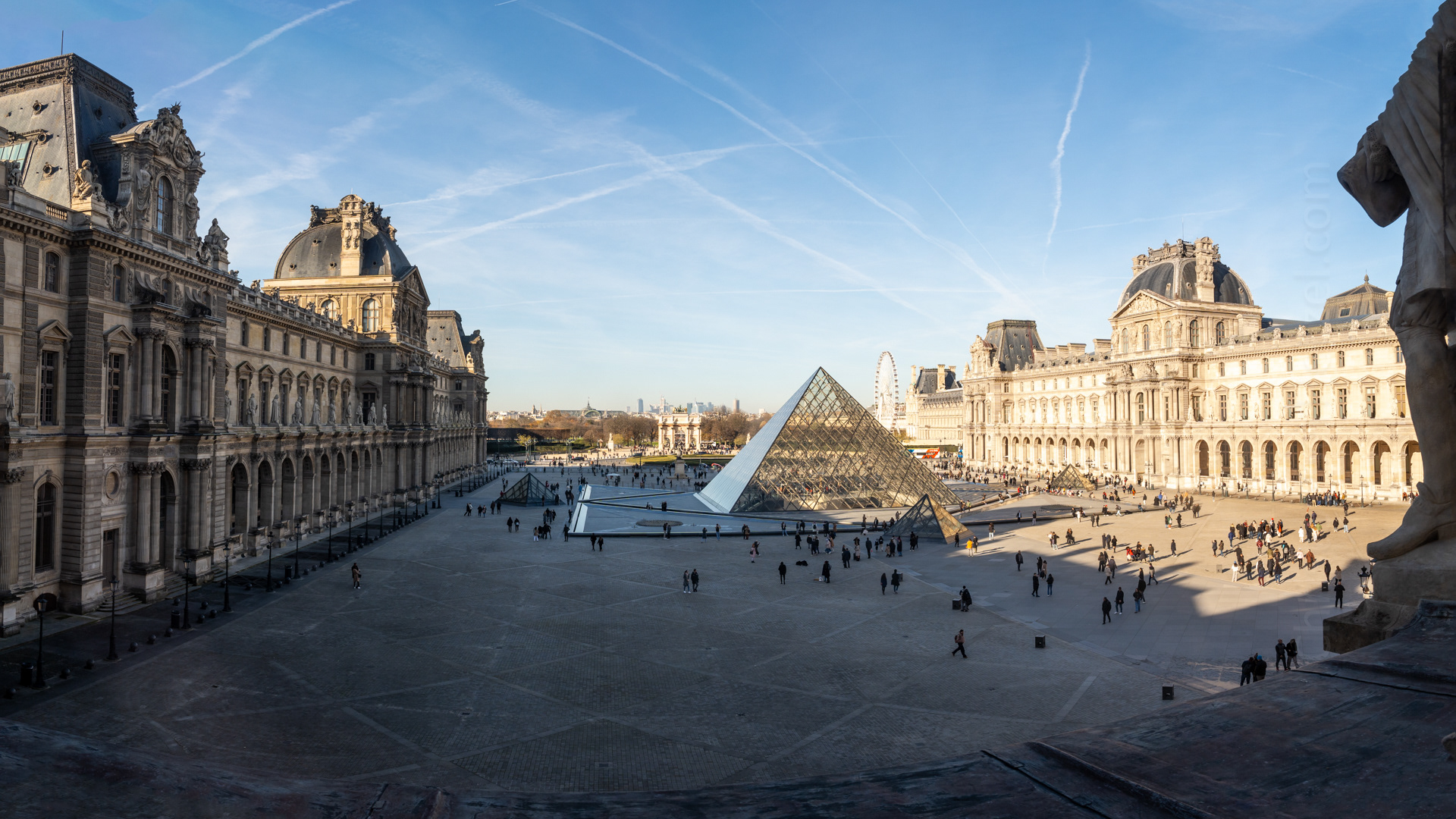 One of the most famous museums in the world, the Louvre is the national art museum in Paris. It occupies the Louvre Palace, a royal residence originally built in the late 12th to 13th century and redesigned and extended many times. During the French Revolution, the National Assembly decreed the Louvre should be used as a museum to display the nation's masterpieces. The museum opened on 10 August 1793. The Louvre pyramid, designed by renowned architect I. M. Pei in the 1980s as a new main entrance to the museum. The Arc de Triomphe du Carrousel is in the background and the gardens of the Jardin des Tuileries beyond that. The roof of the Grand Palais is in the far distance.
