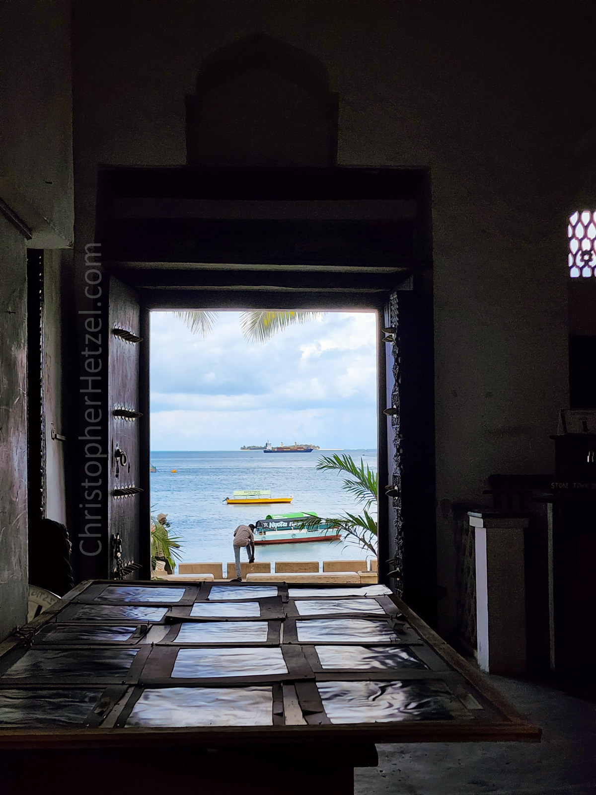 View from inside the Old Customs House, looking out the front door to the sea. Photo by JMS.