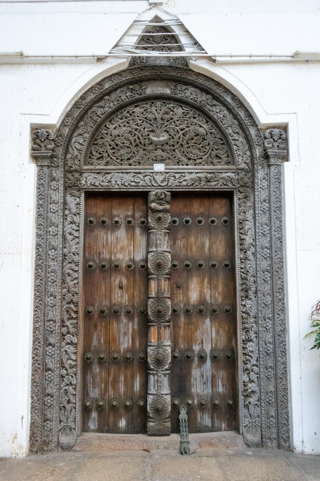 Door on the Zanzibar Petroleum Regulatory Authority Building (formerly the old People's Bank of Zanzibar). One of at least three similar-looking doors in Stone Town carved by the same artisan.